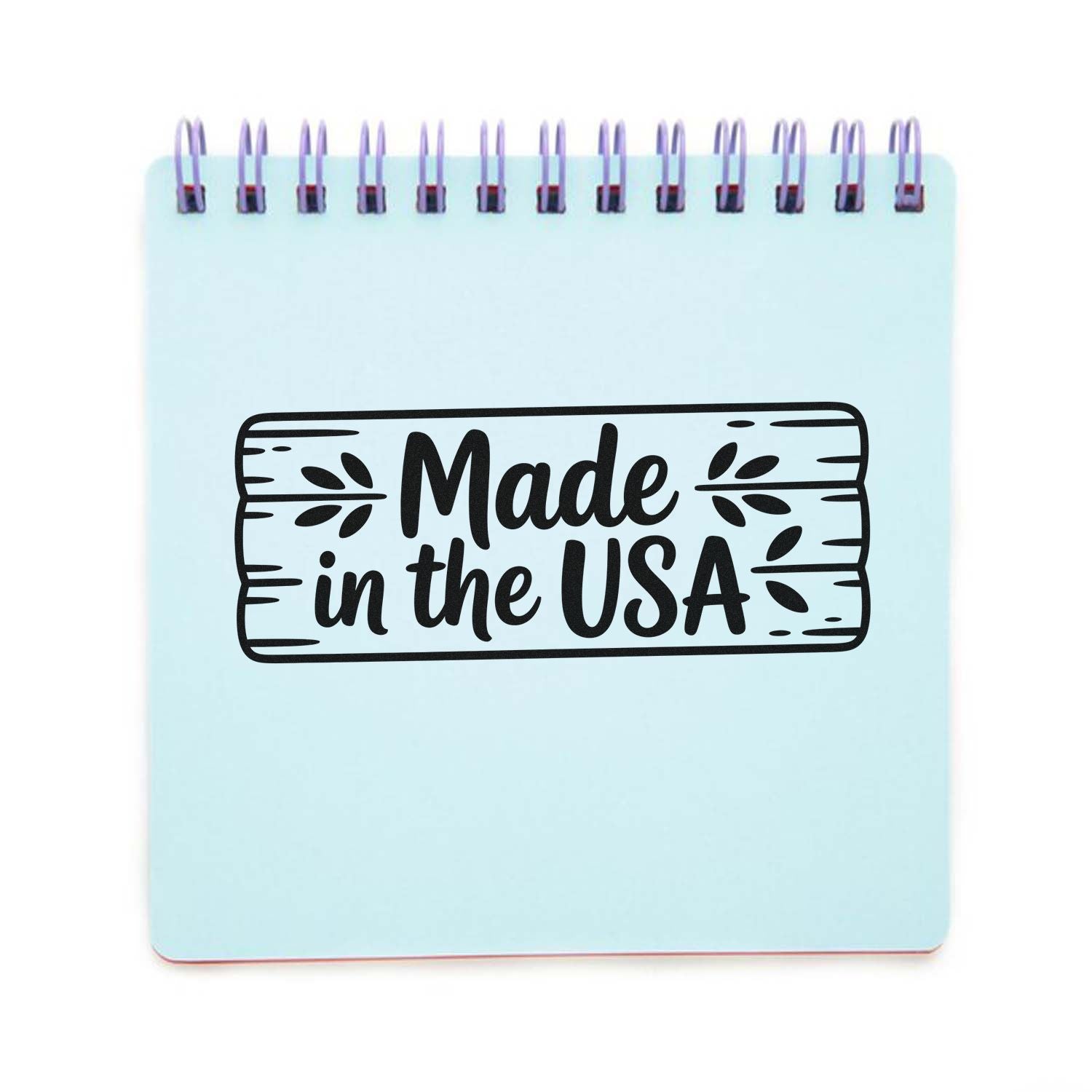 Made in the USA rubber stamp design on a notepad, ideal for handmade product packaging and patriotic branding.