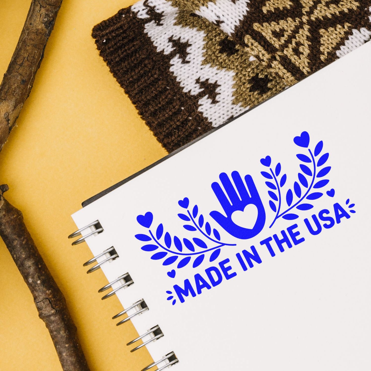 Made in the USA rubber stamp design with heart and leaf motif on notebook, ideal for patriotic branding and handmade products.