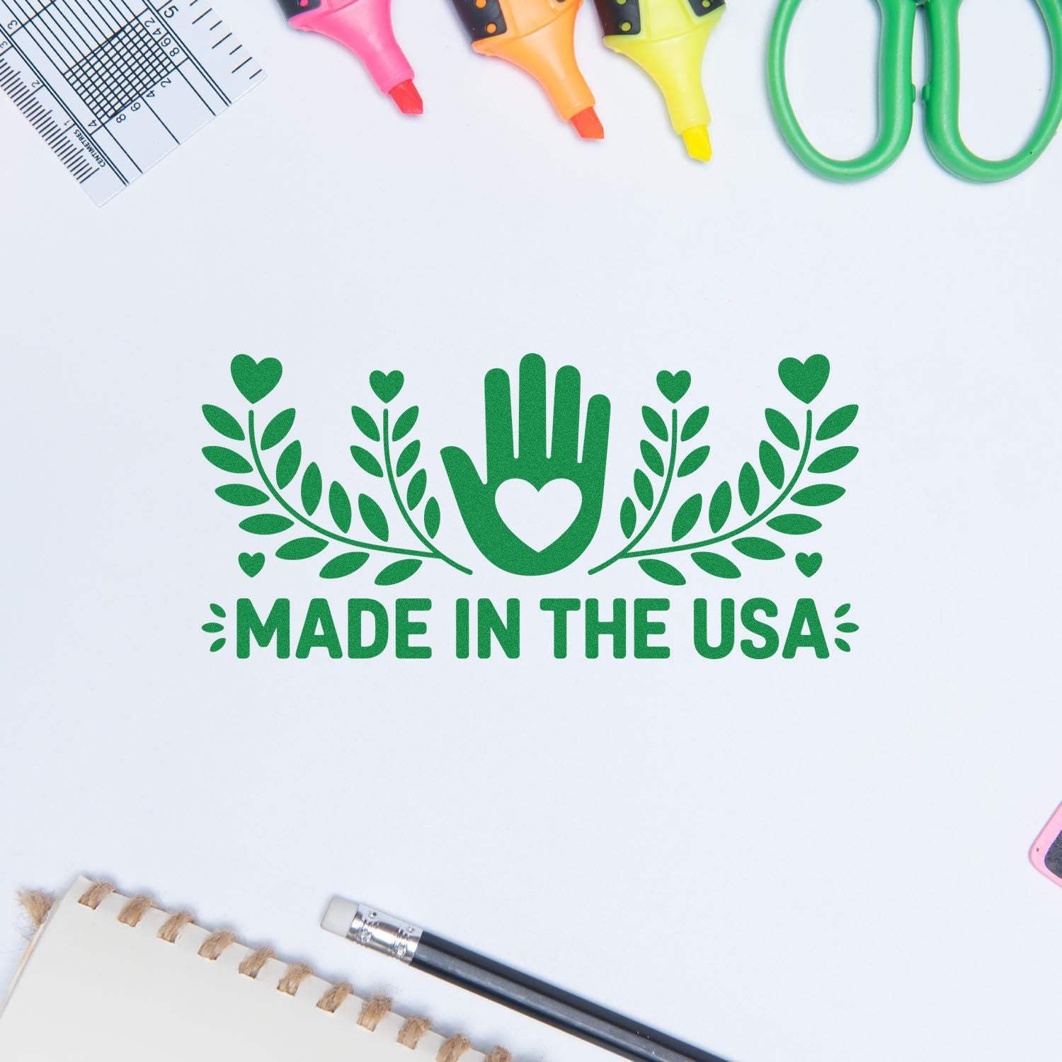 Made in the USA rubber stamp design with green hand-heart and leaf motif for craft projects, branding, and packaging.