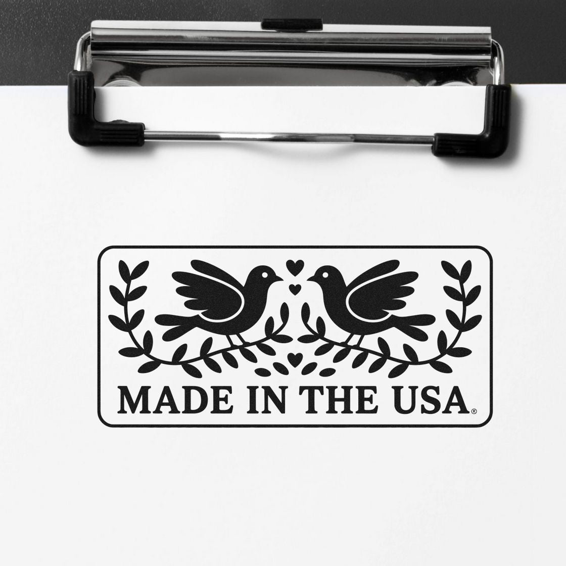 Made in the USA rubber stamp imprint with birds and leaves for branding American-made products.