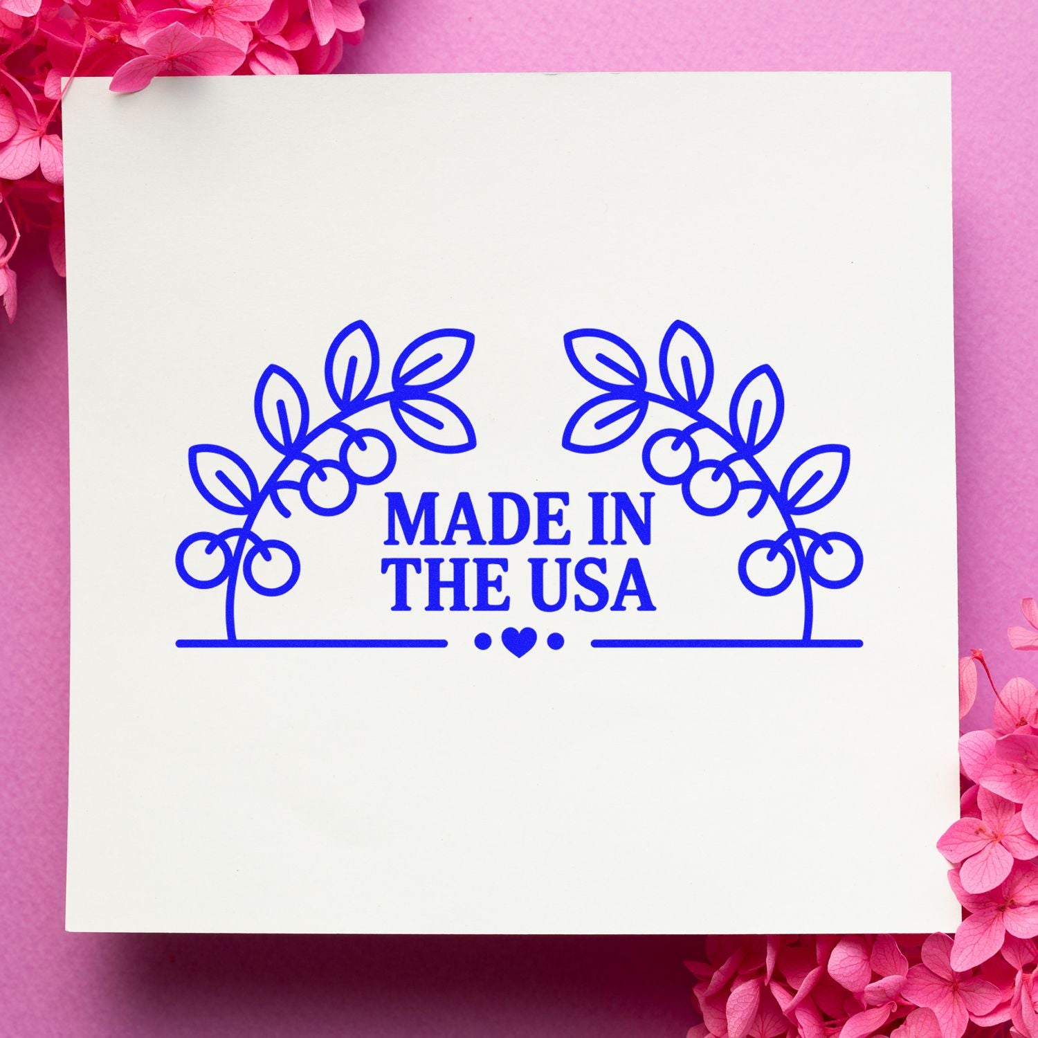 Made in the USA rubber stamp design with floral wreath and heart, ideal for product packaging, handmade goods, and craft branding.