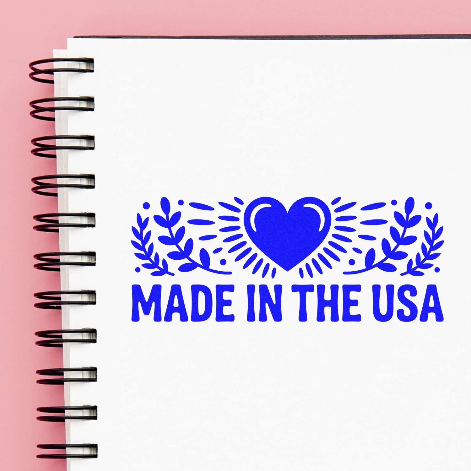 Made in the USA rubber stamp design with heart and laurel accents for patriotic product labeling, packaging, and branding.