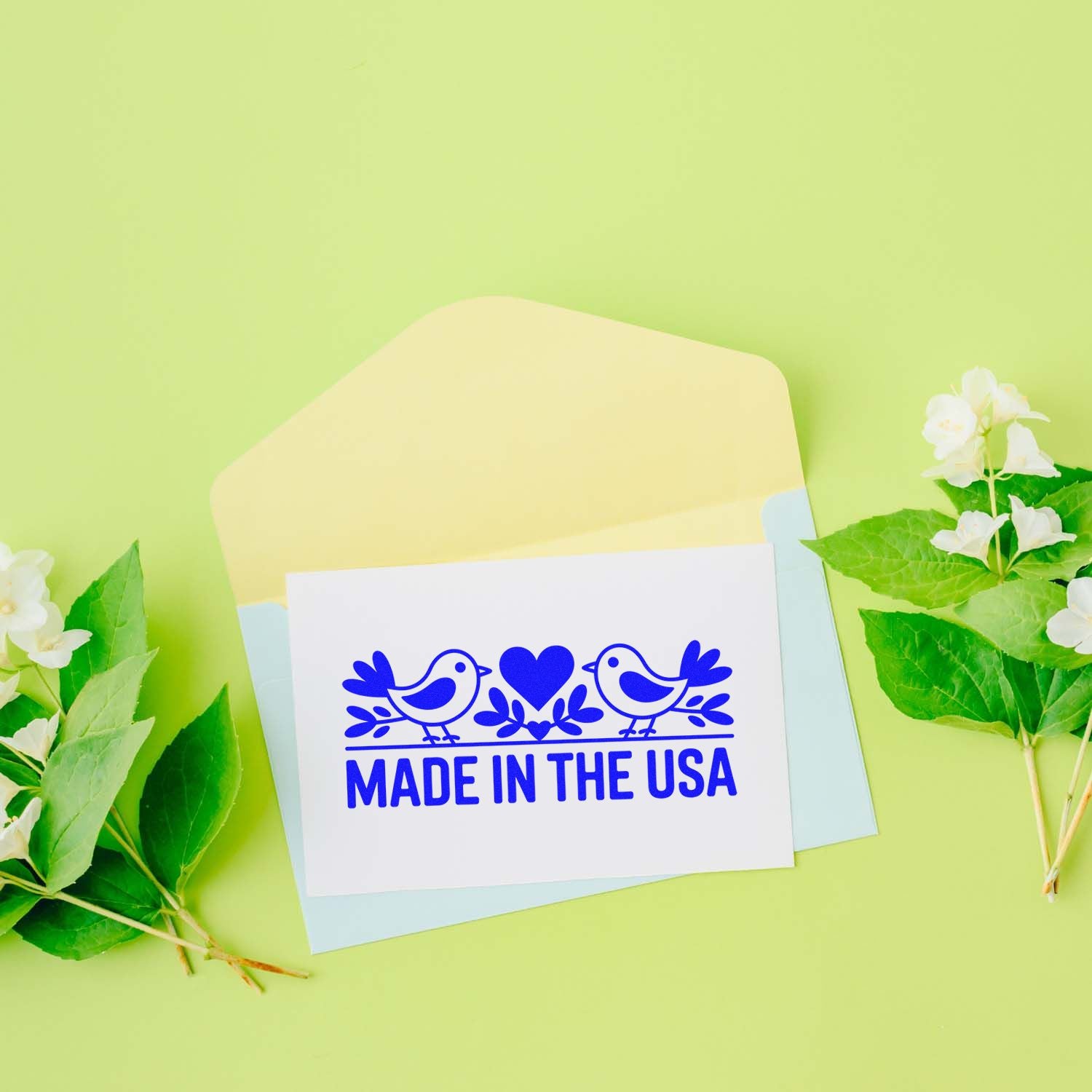Made in the USA rubber stamp design with birds and heart, perfect for handmade cards, packaging, and craft branding.
