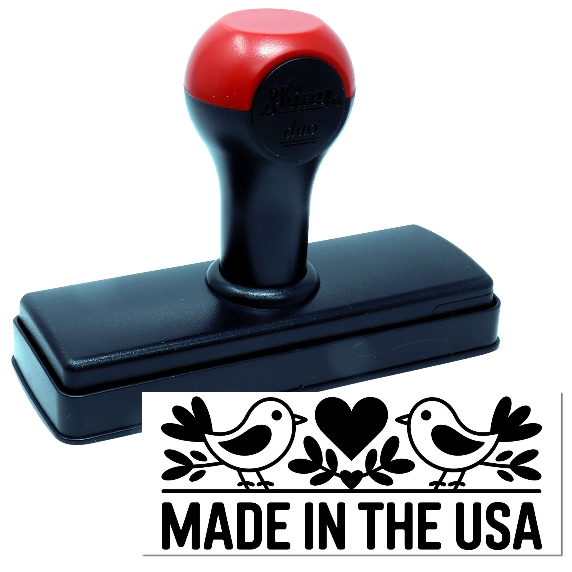 Self-inking rubber stamp with Made in the USA bird and heart design imprint.