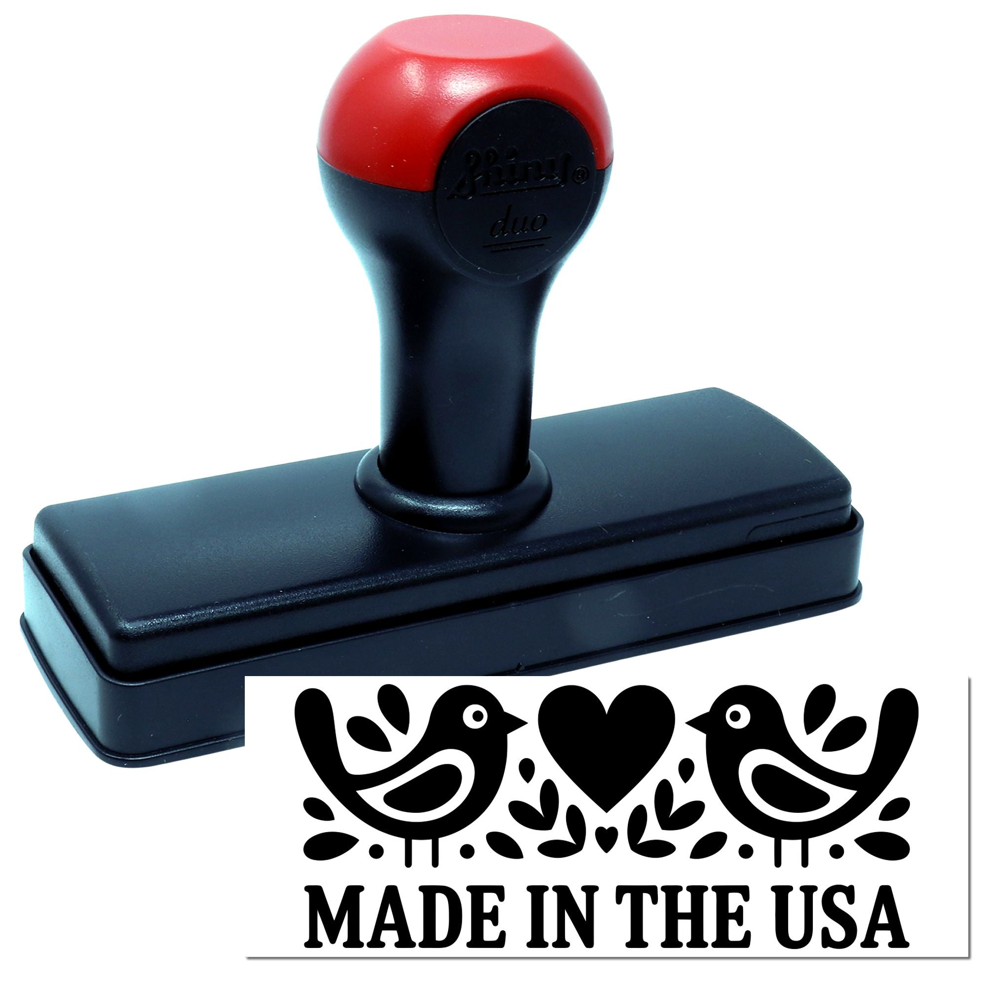 Self-inking rubber stamp with Made in the USA bird and heart design imprint for patriotic packaging and branding.