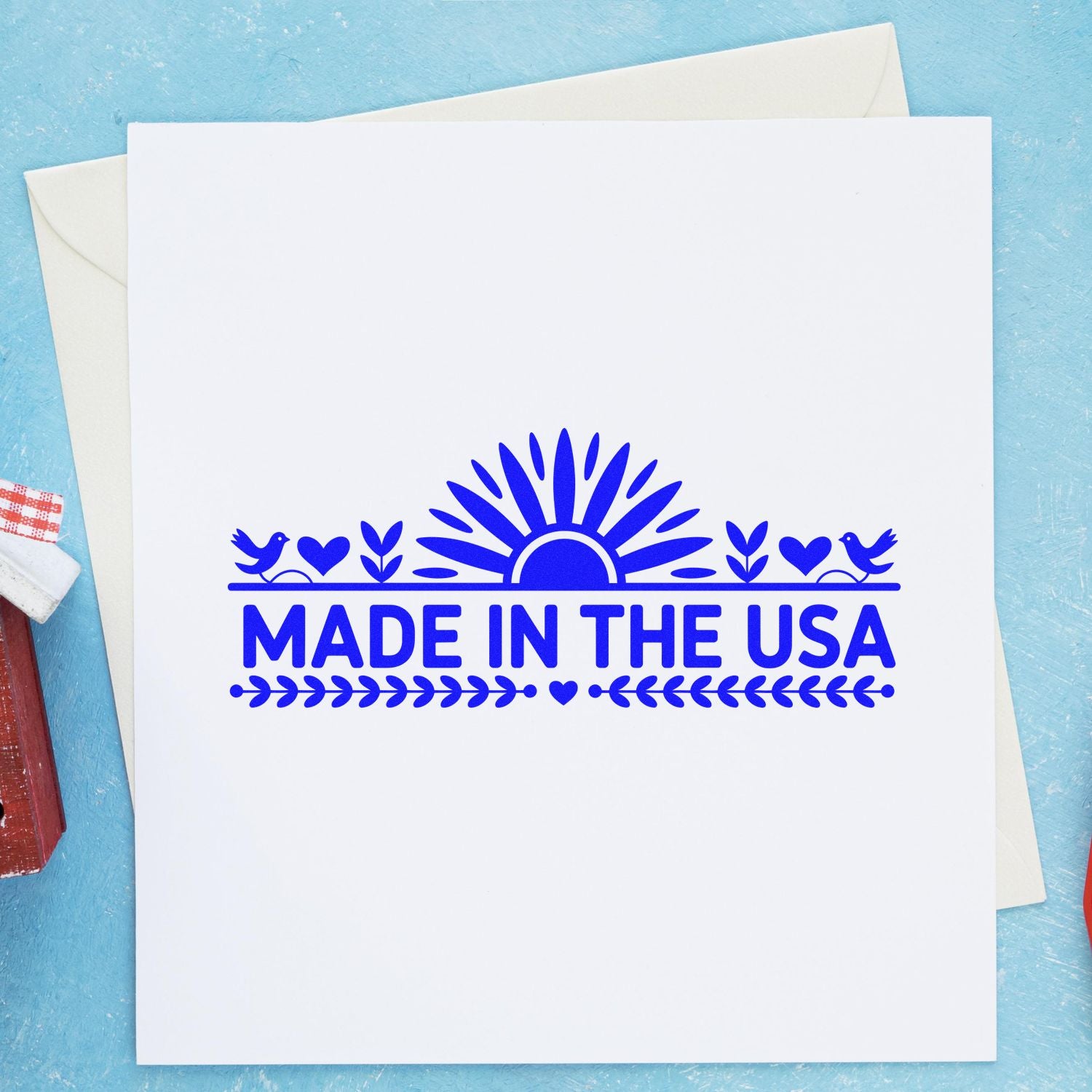 Blue Made in the USA rubber stamp design on a greeting card, ideal for handmade products, packaging, and patriotic crafts.