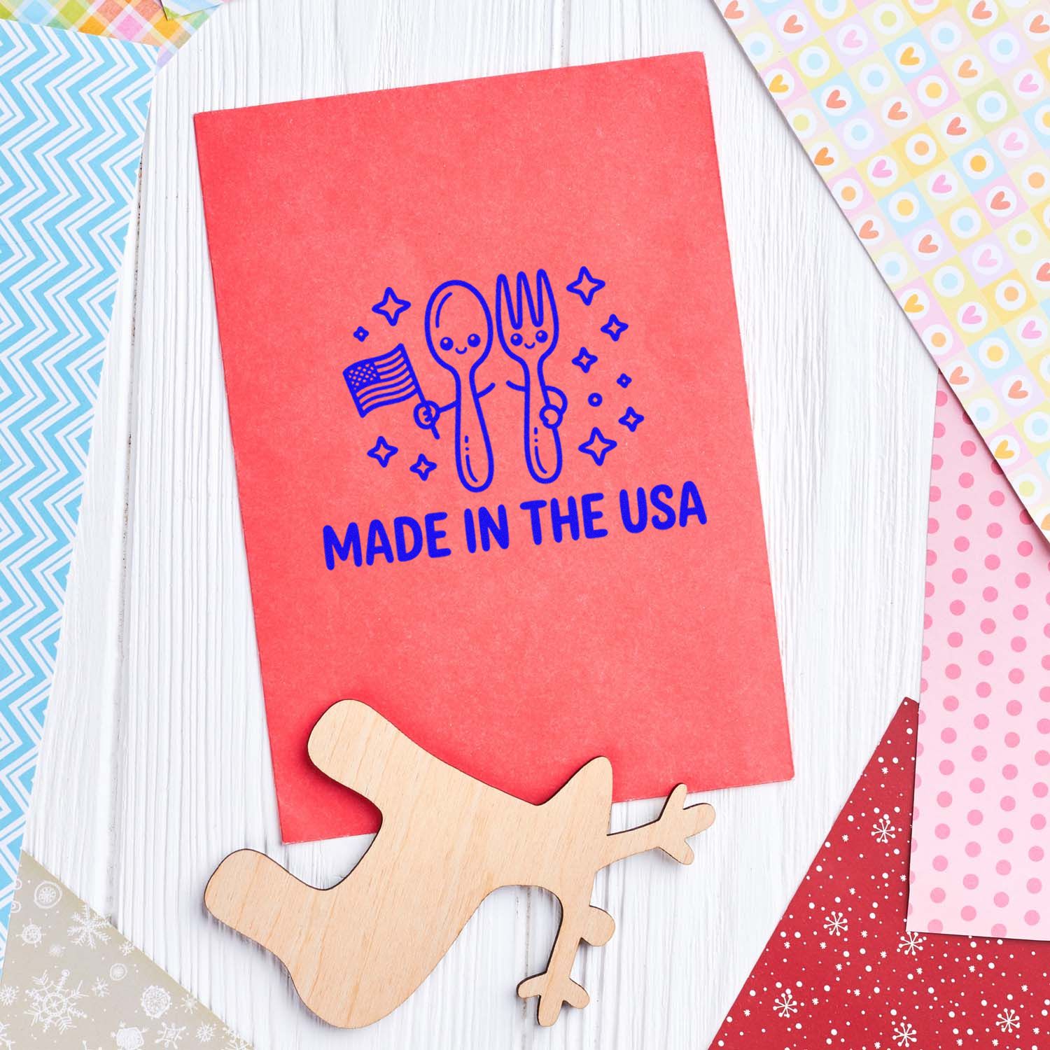 Made in the USA rubber stamp design on red card, featuring utensils and stars, with decorative scrapbook paper for crafts.