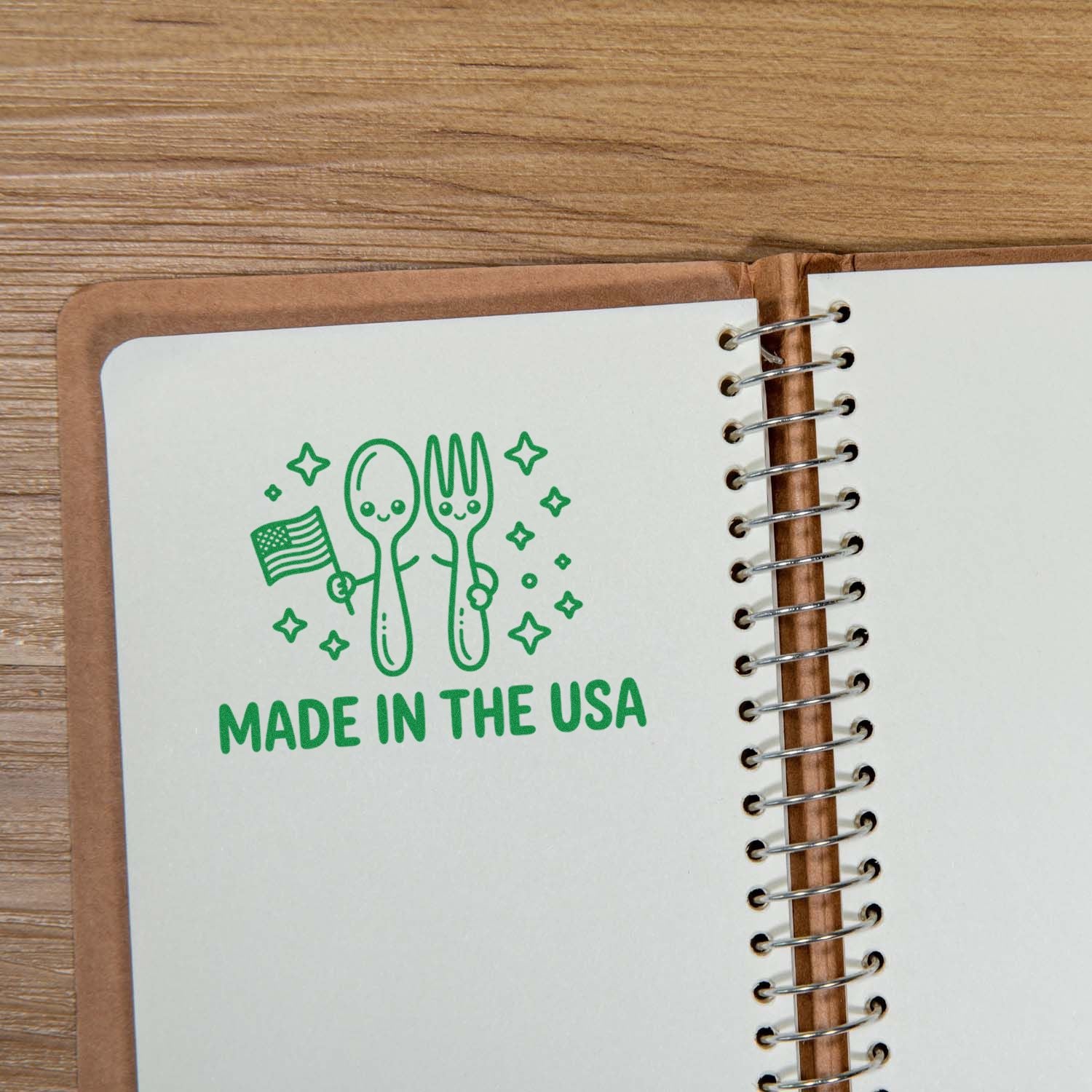 Made in the USA rubber stamp imprint on a notebook page, showing a spoon and fork with an American flag.