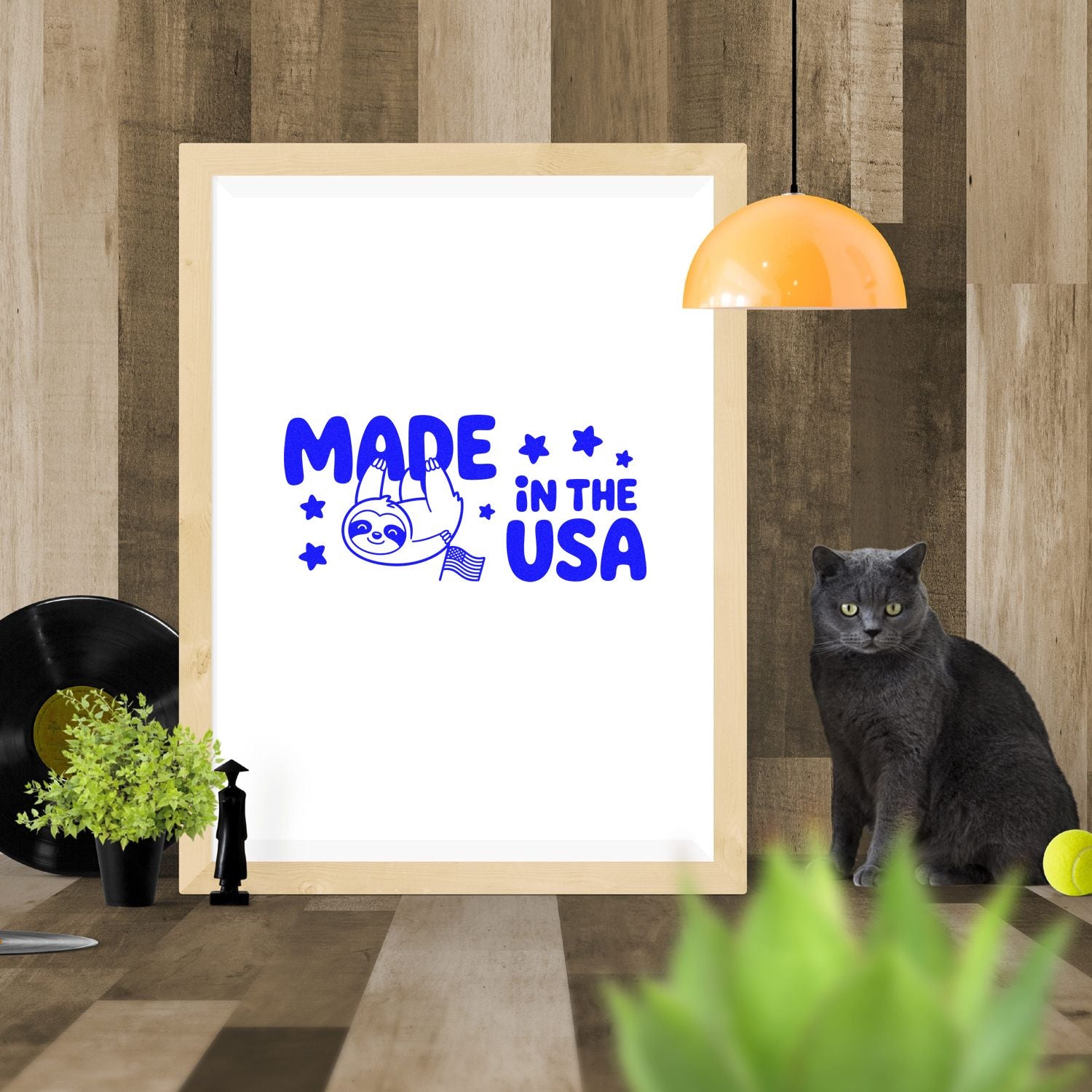 Made in the USA rubber stamp design with sloth graphic, shown as a framed mockup for custom stamping.