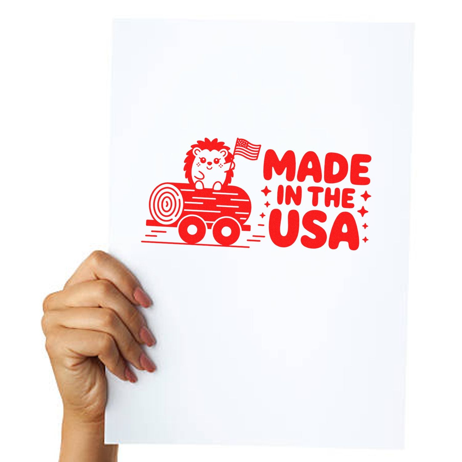 Made in the USA custom rubber stamp design with hedgehog and American flag, shown on a white sheet held in hand.