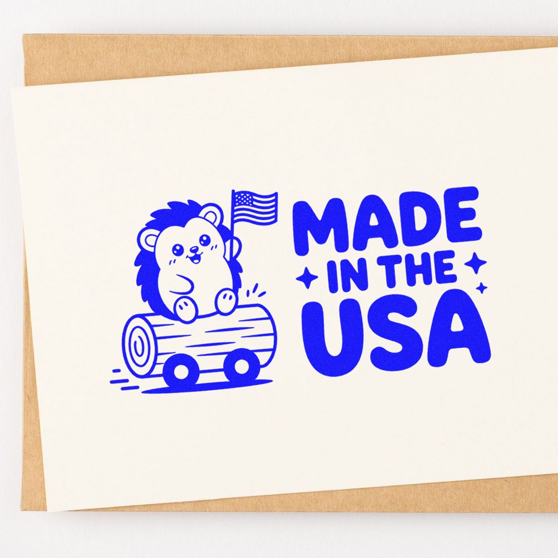 Blue Made in the USA rubber stamp with bear and flag, perfect for patriotic packaging, crafts, and branding.