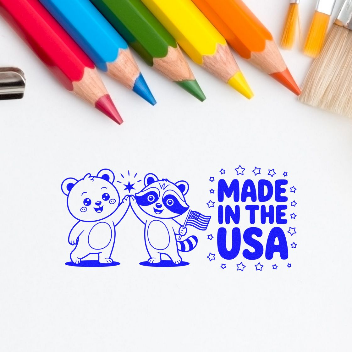 Made in the USA rubber stamp design featuring cute animal mascots and stars, shown with colored pencils.