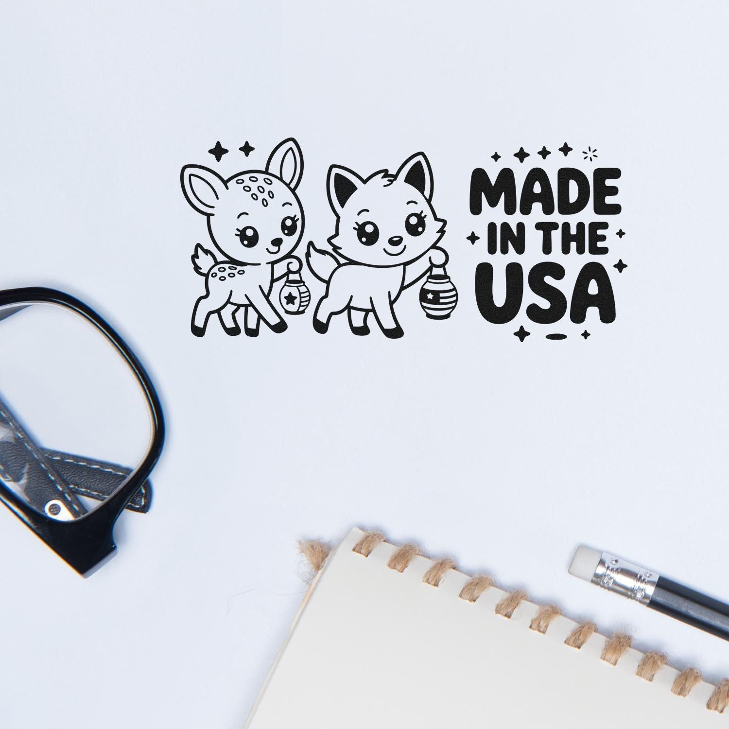Made in the USA rubber stamp design with cute deer and fox holding lanterns, perfect for handmade crafts and packaging.
