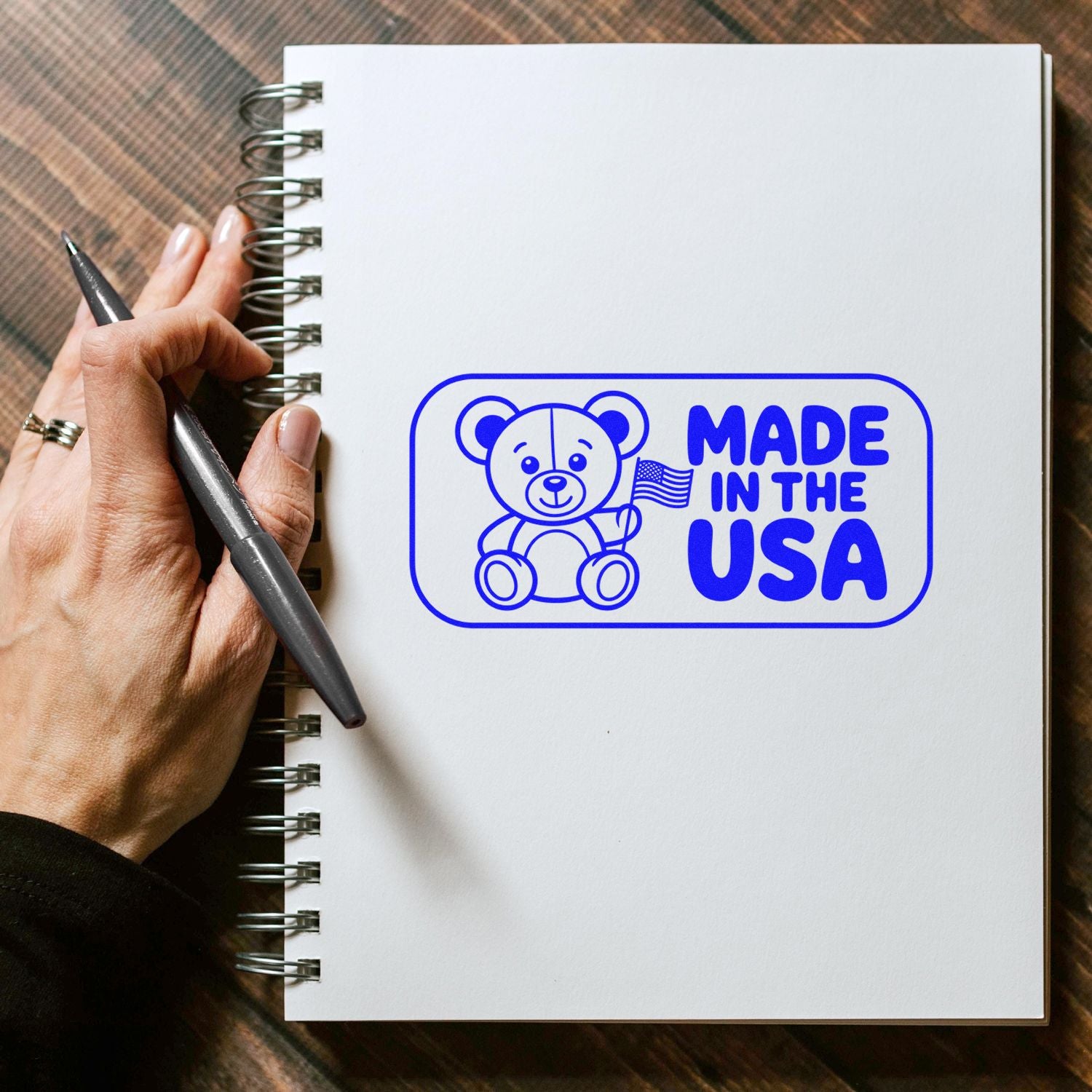 Made in the USA rubber stamp with teddy bear and flag, perfect for custom packaging, crafts, and branding.