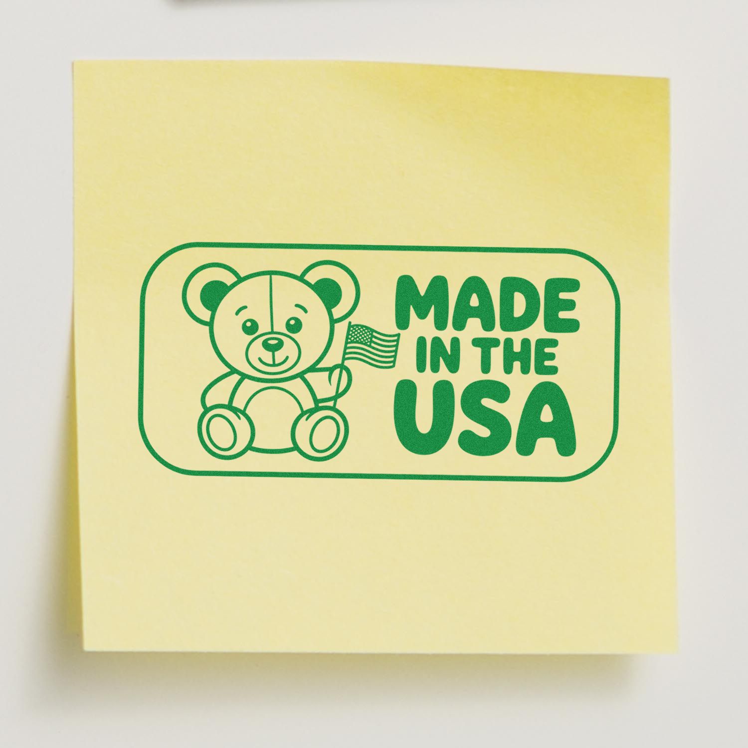 Made in the USA teddy bear rubber stamp imprint on yellow sticky note