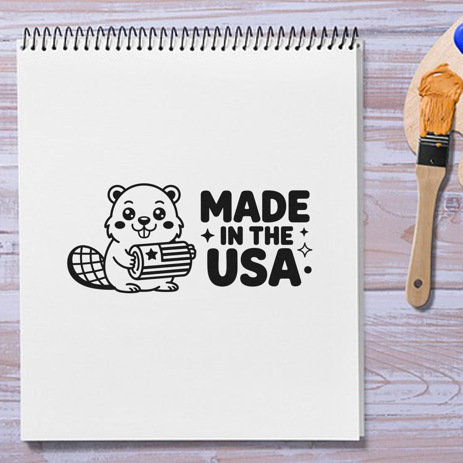 Made in the USA beaver rubber stamp design on notebook page, perfect for patriotic craft branding.