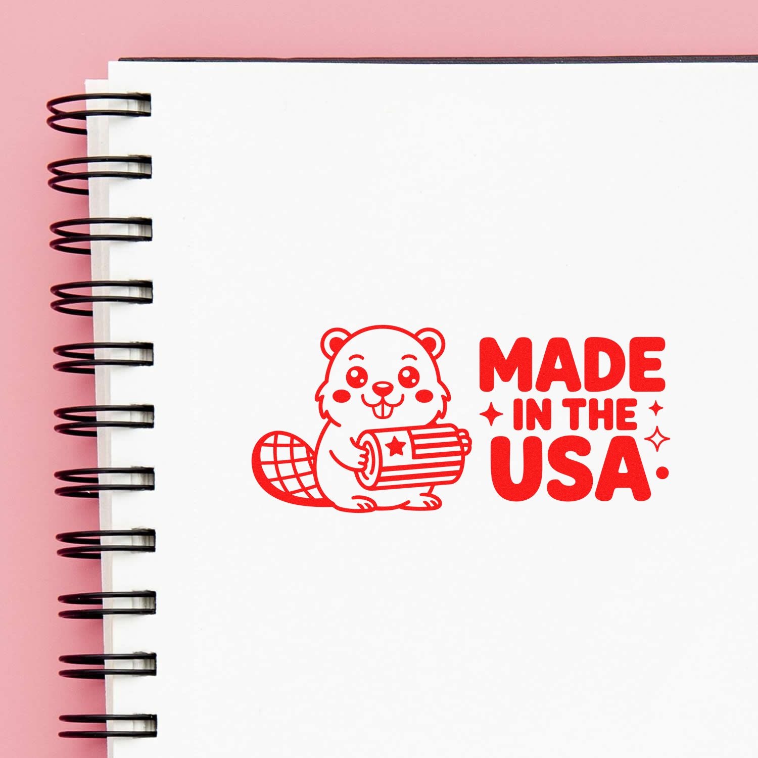 Made in the USA rubber stamp design with patriotic beaver graphic on a notebook page.