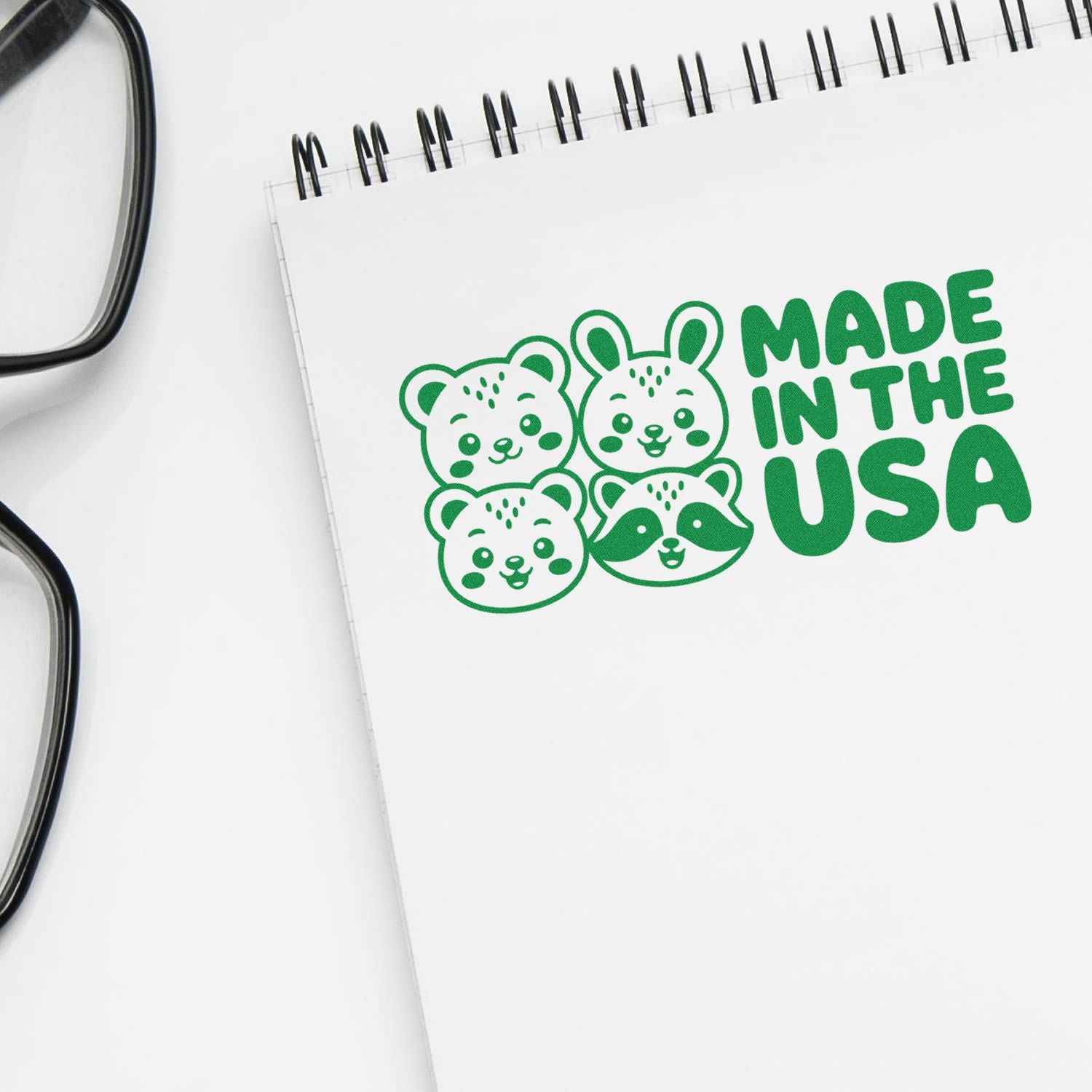 Made in the USA rubber stamp design with cute animal faces, printed on notebook for custom stamp branding.