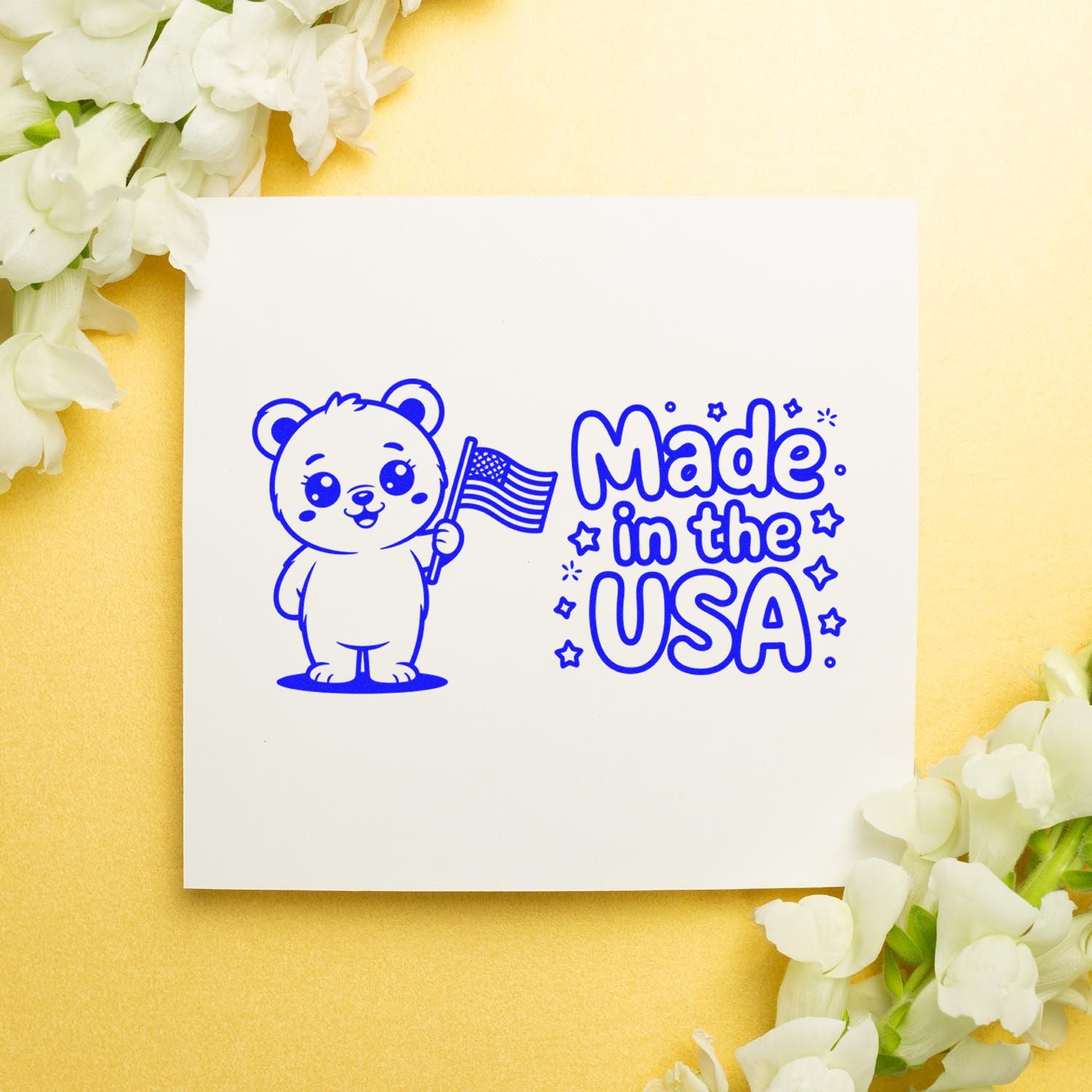 Made in the USA rubber stamp design with patriotic bear holding flag, ideal for custom craft packaging and branding.