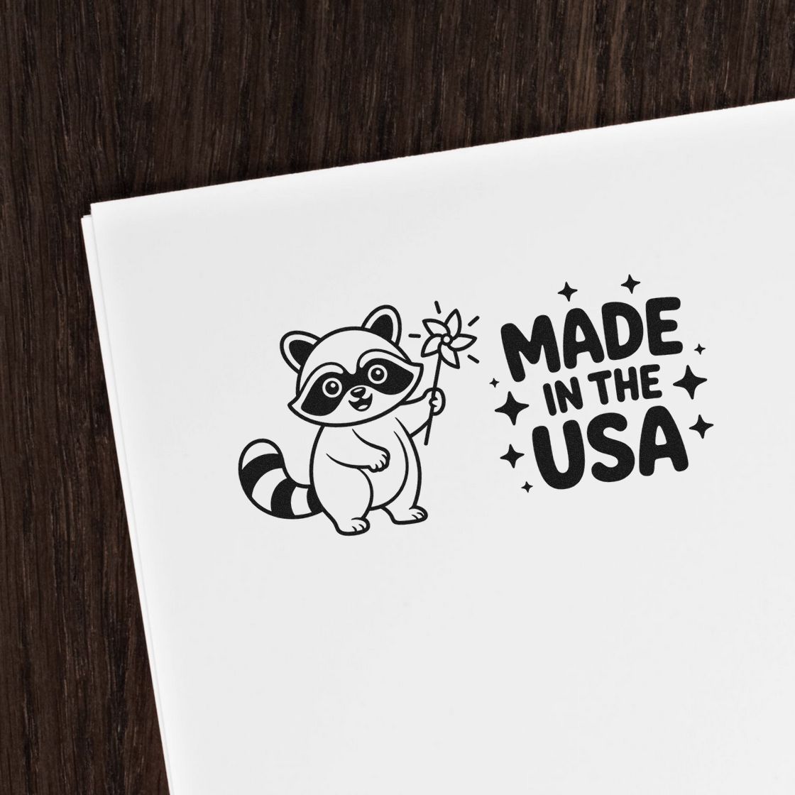 Custom rubber stamp design with raccoon and Made in the USA text for patriotic packaging and branding.