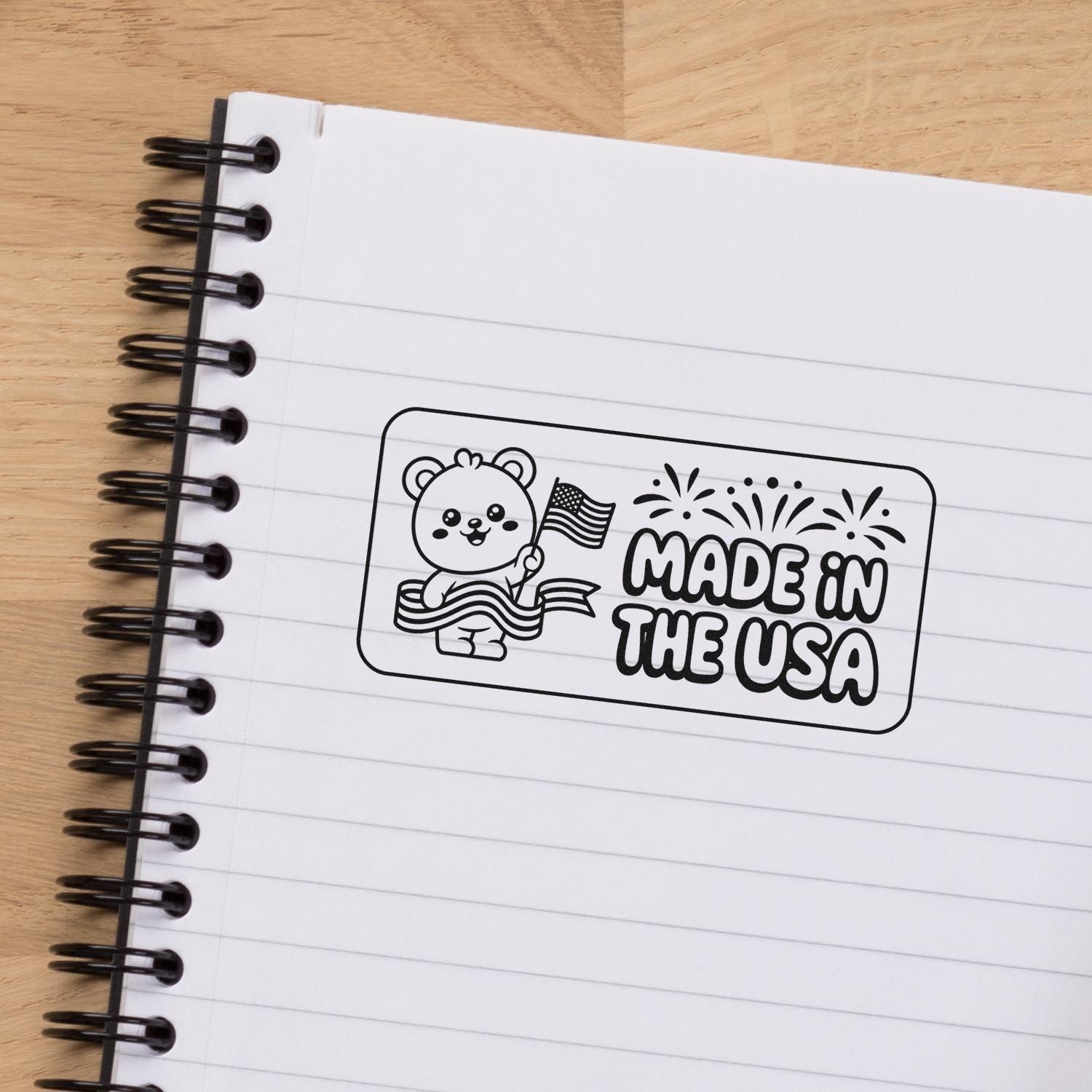 Made in the USA rubber stamp design with bear and fireworks for patriotic packaging, crafts, and business branding.