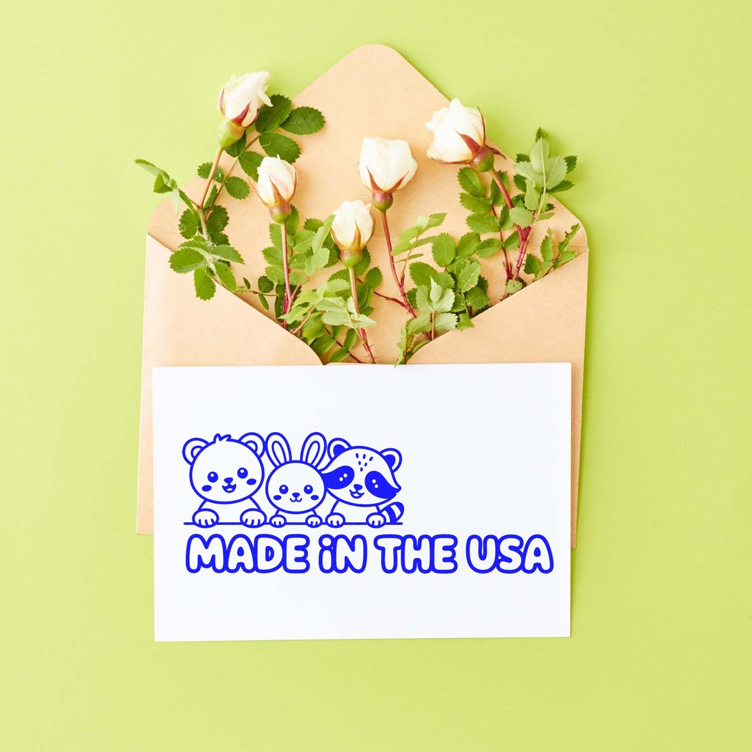 Cute animal rubber stamp design with Made in the USA text on a card in an envelope with flowers.
