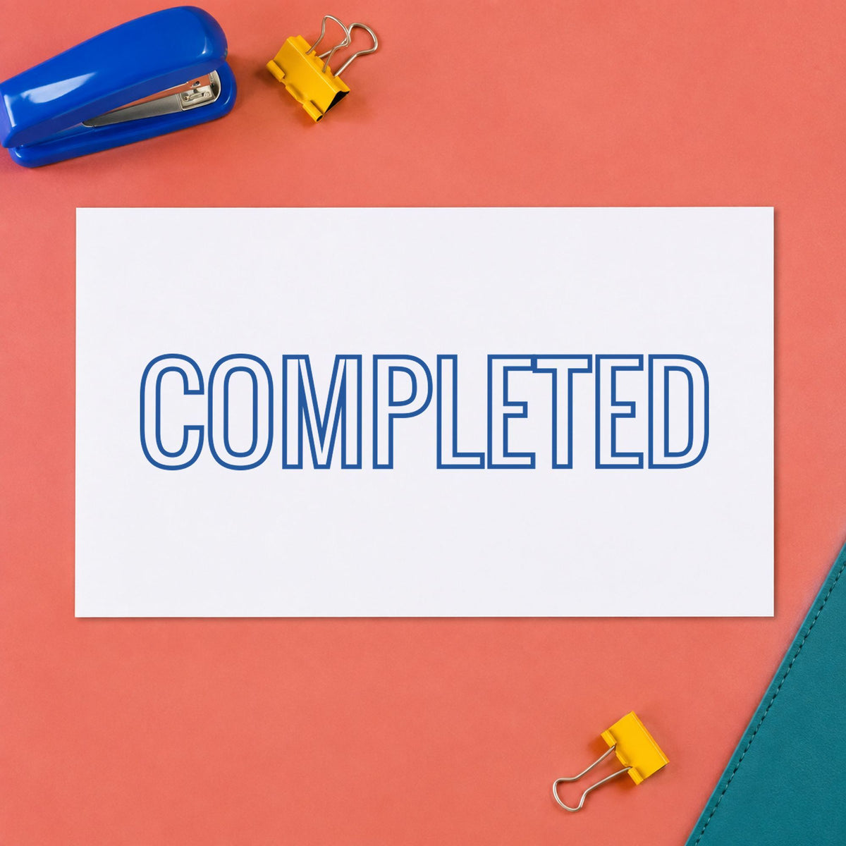 Blue Completed Office Stamp leaving a clean "Completed" impression
