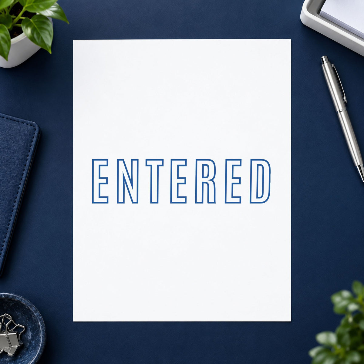 Blue Entered Stamp leaving a clean "Entered" impression