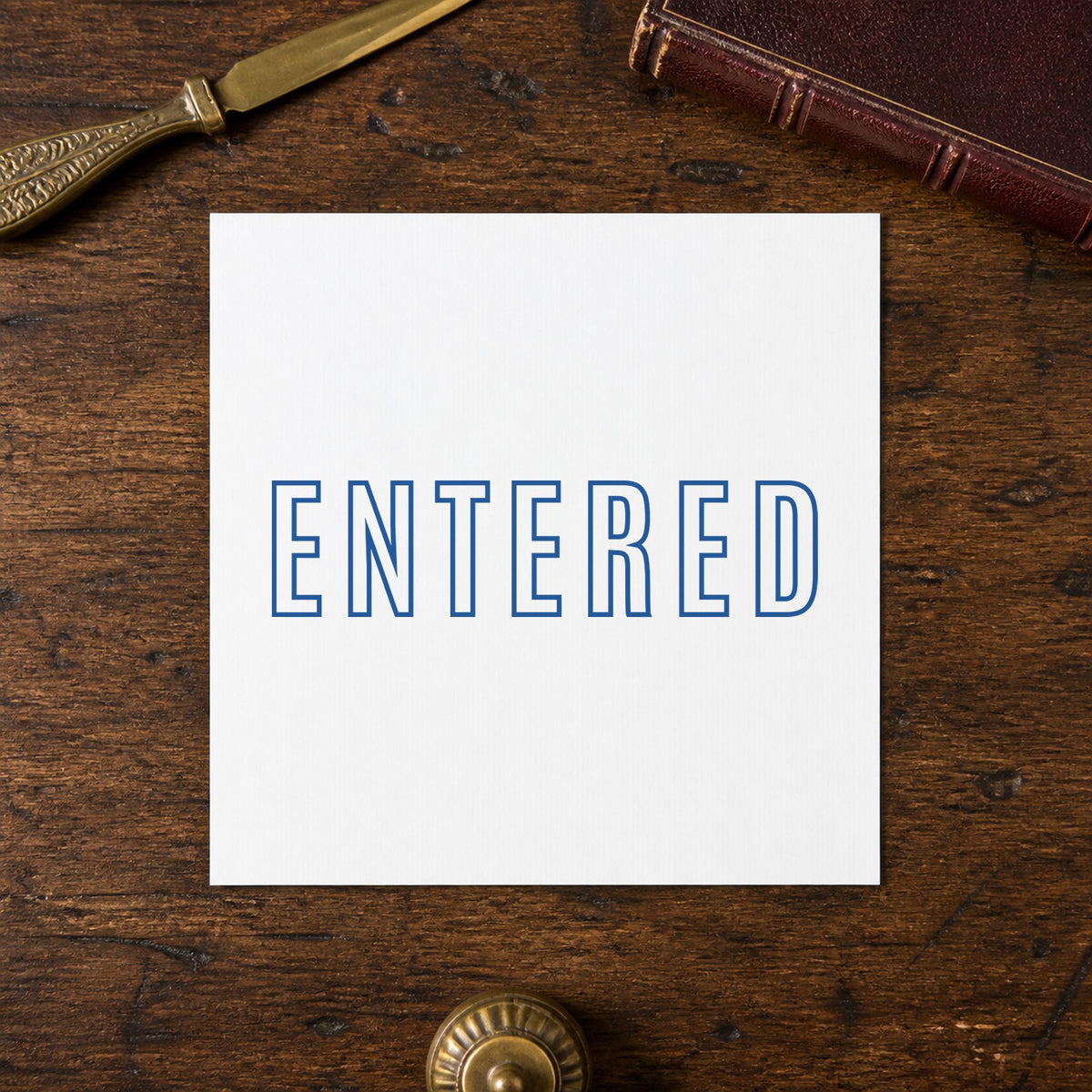 Marking a page "Entered" with the Blue Entered Stamp