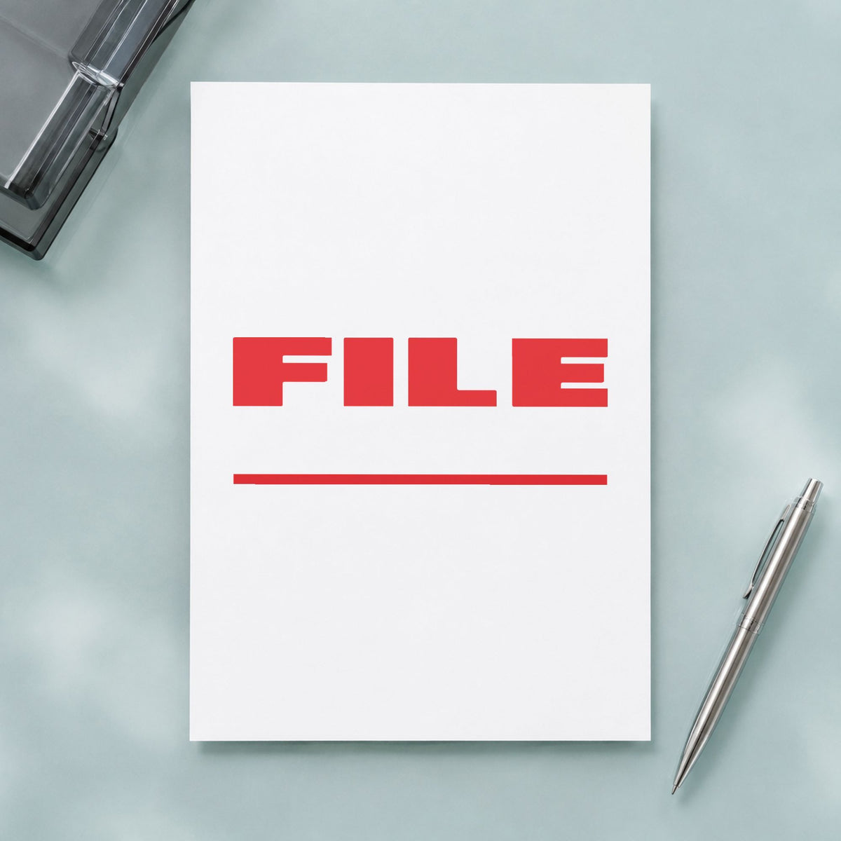 "File" imprint stamped on a document with the Xstamper File Stamp – Bold Red Pre-Inked