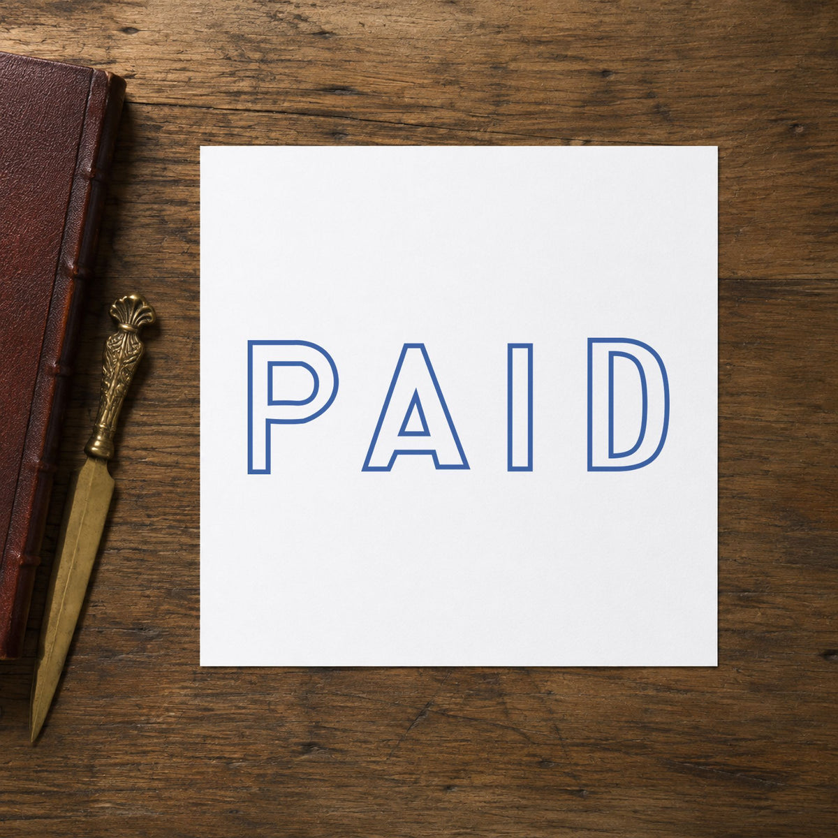 "Paid" stamp mark in everyday office use, Xstamper 1005