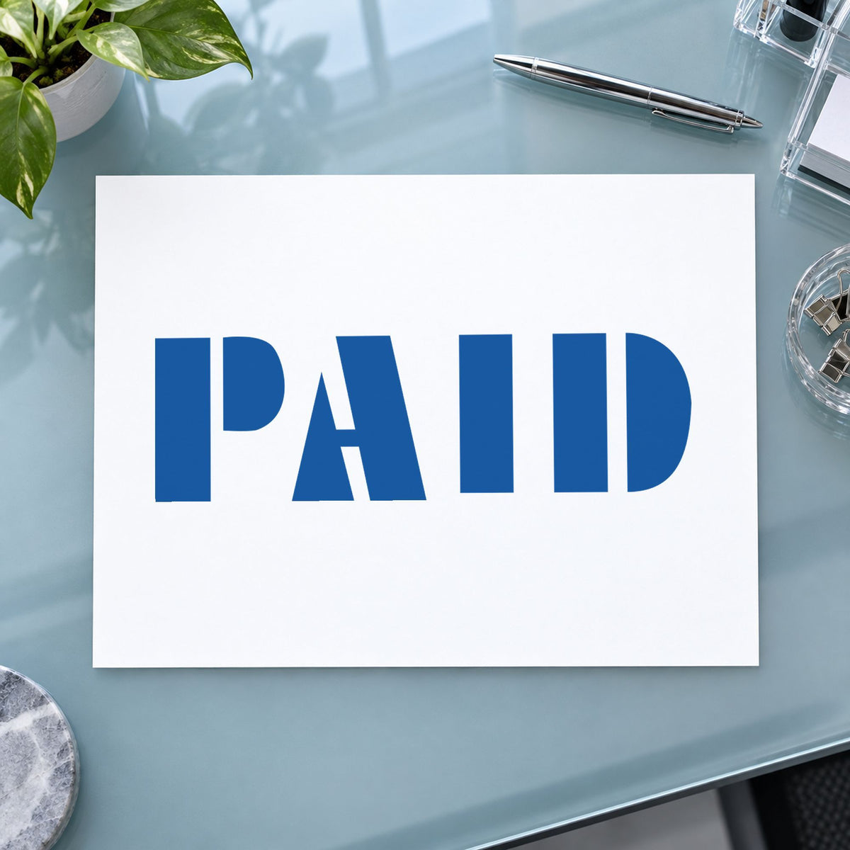 "Paid" stamp mark in everyday office use, Xstamper 1335