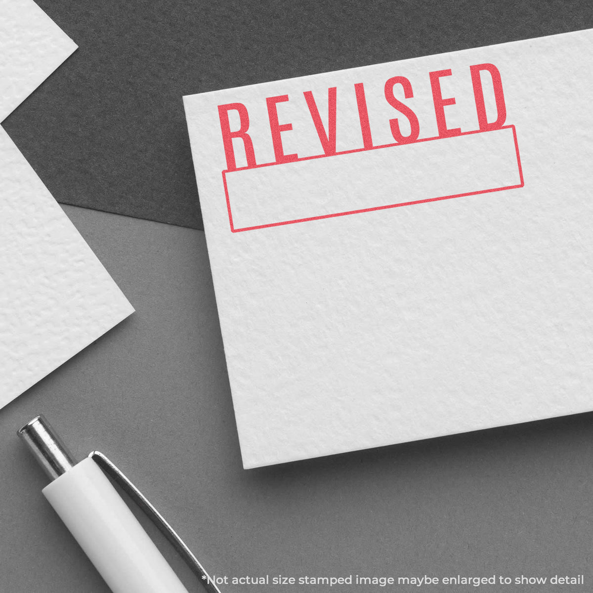 "Revised" imprint used to flag items for handling, Xstamper Revised Stamp