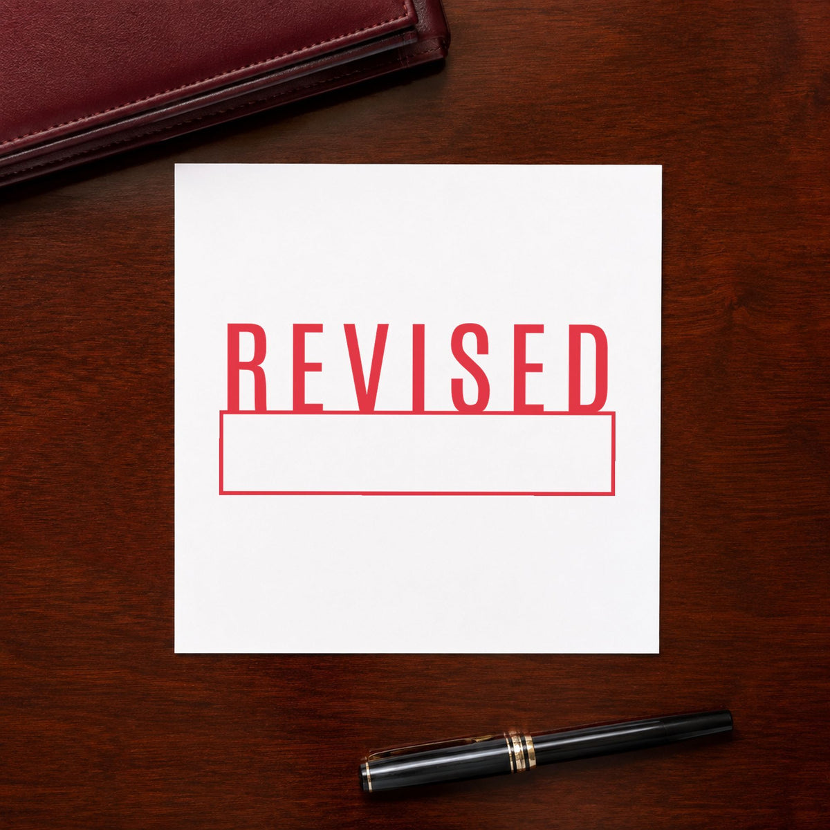 "Revised" imprint at 1/2 x 1-5/8 in, no separate ink pad required