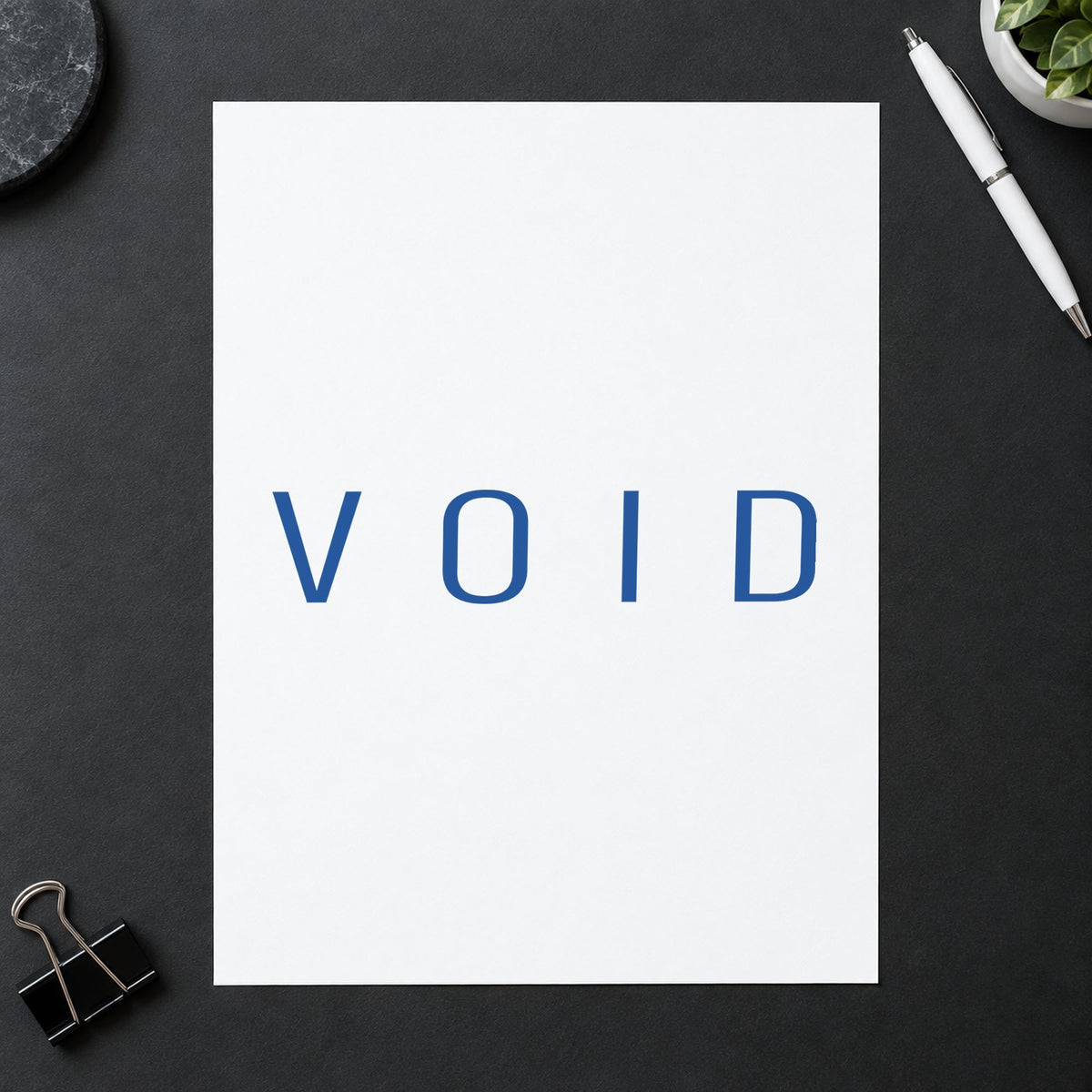 "Void" imprint stamped on a document with the Xstamper Void Stamp – Blue Pre-Inked