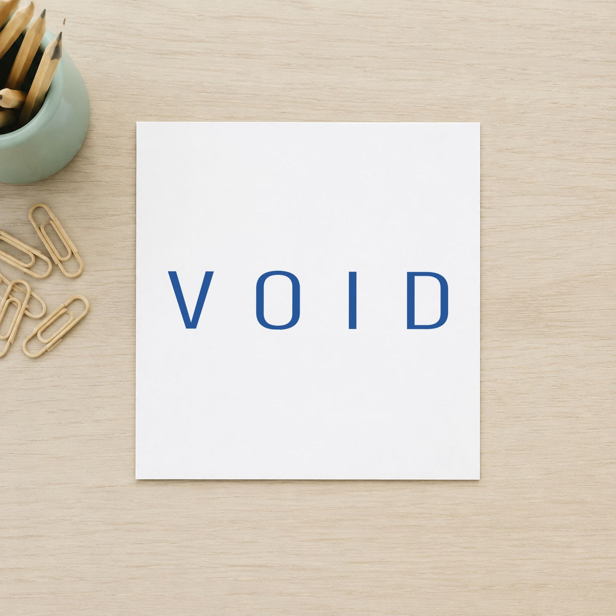 Xstamper Void Stamp – Blue Pre-Inked leaving a clean "Void" impression