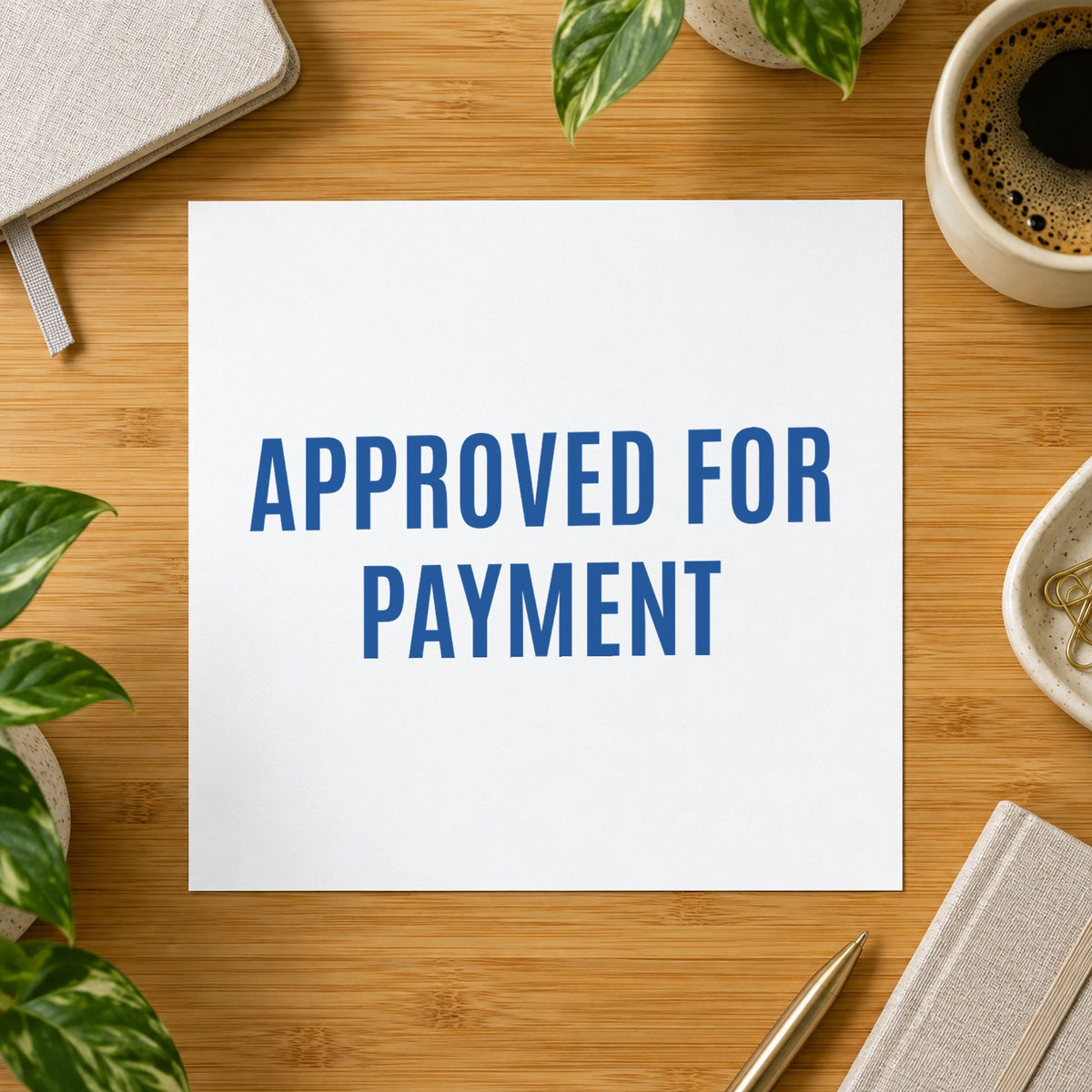 "Approved for payment" mark added to paperwork with a pre-inked Xstamper stamp