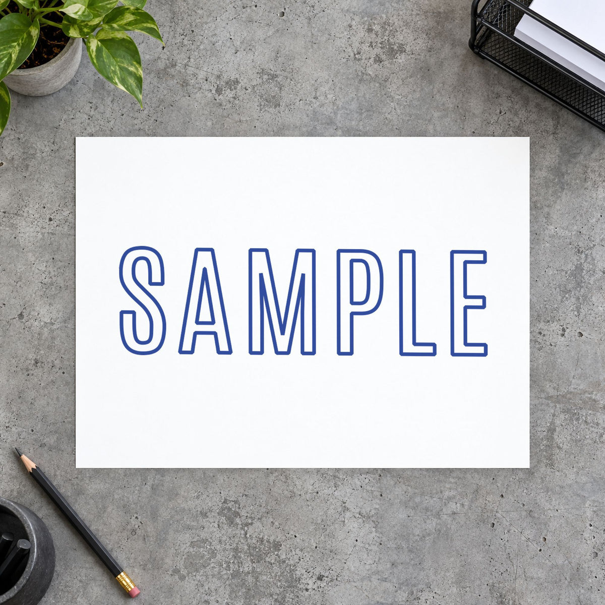 "Sample" imprint stamped on a document with the Xstamper Sample Document Stamp