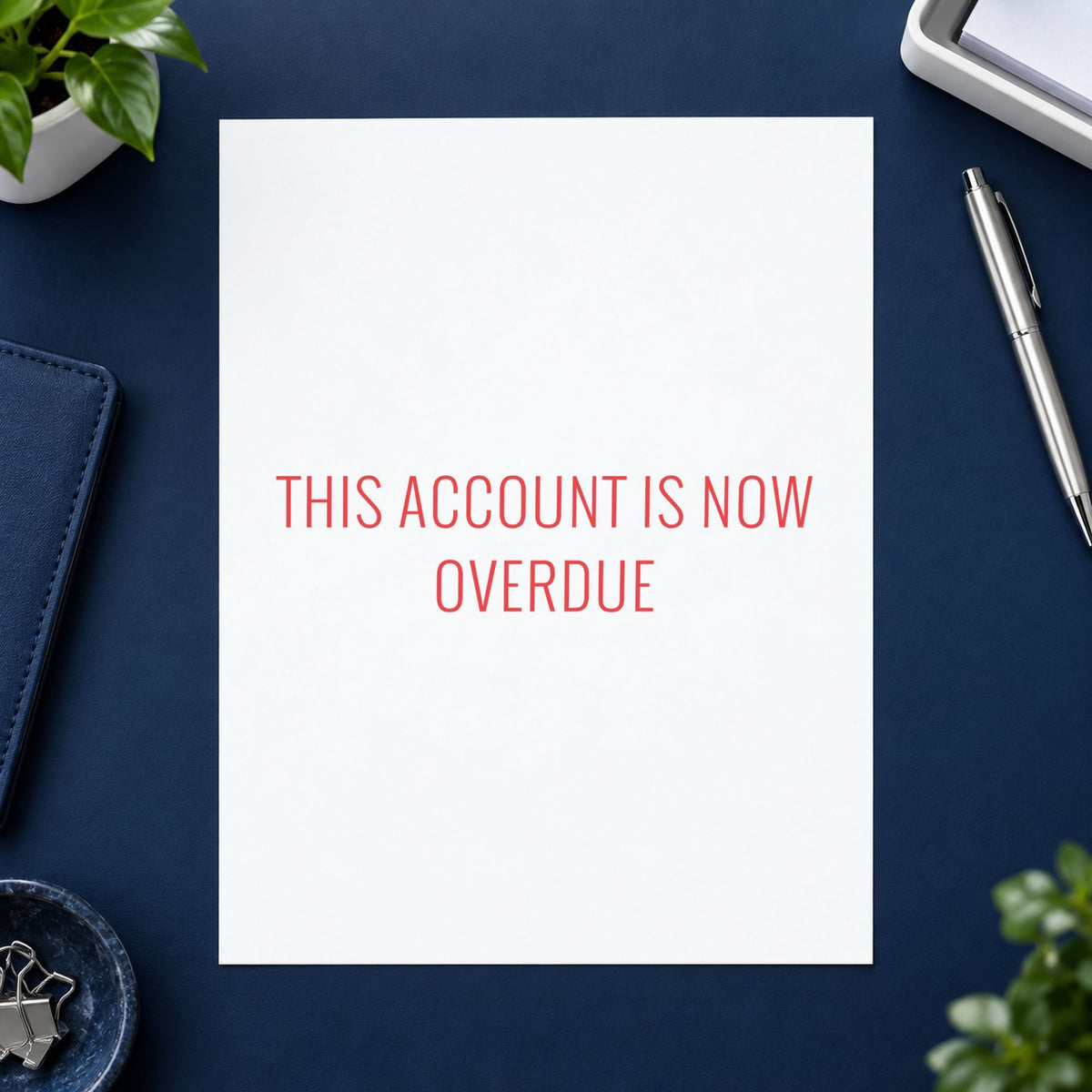 Red This Account Is Now Overdue Invoice Stamp leaving a clean "This account is now overdue" impression