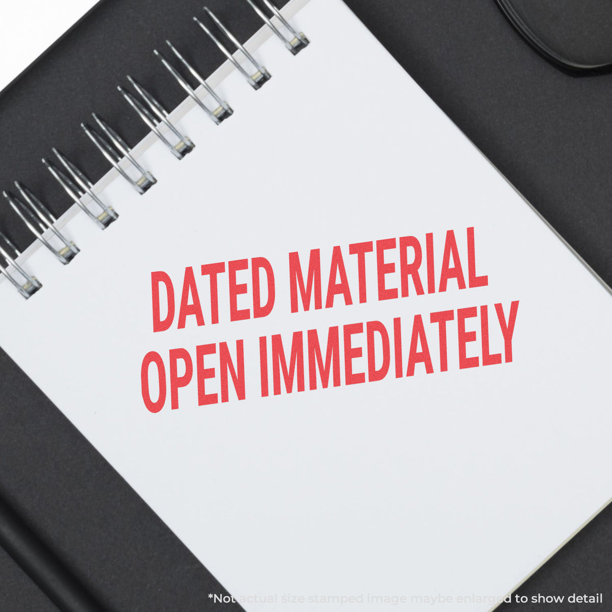 "Dated material open immediately" mark stamped for document handling, Xstamper 3247 stamp