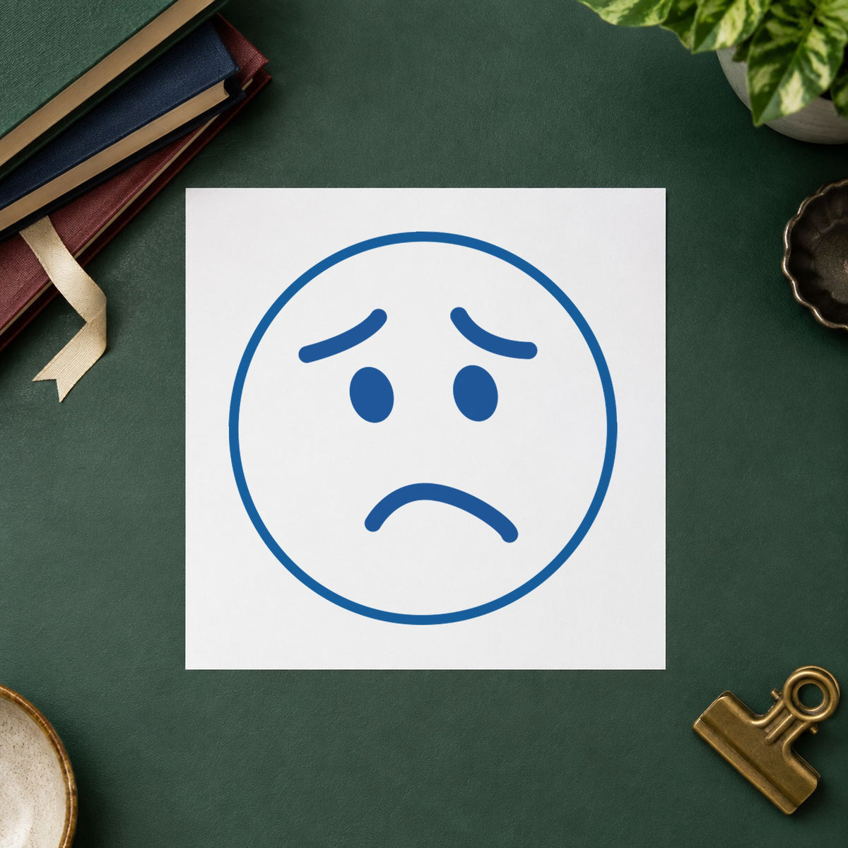 "Frown face" imprint from fixed stock wording, no customization needed
