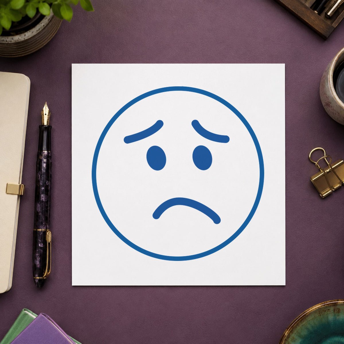 Crisp "Frown face" imprint produced by the Round Frown Face Stamp