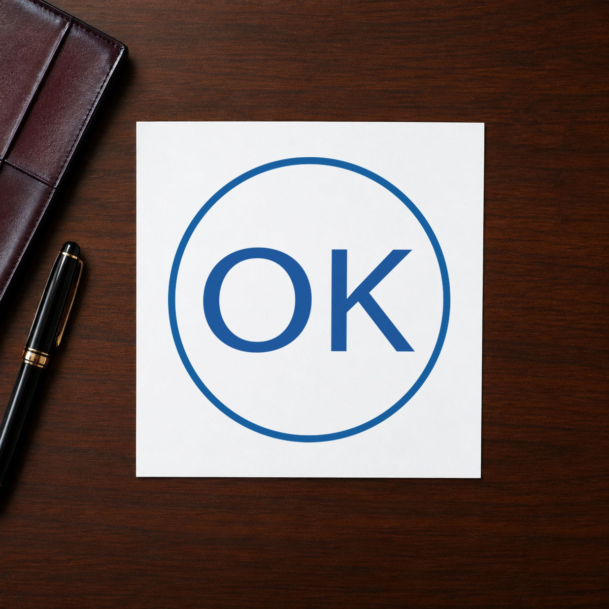 Marking a page "OK" with the OK Approval Stamp – Round Pre-Inked Xstamper