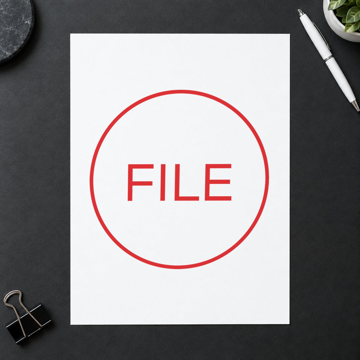 "File" imprint stamped on a document with the Round File Document Stamp