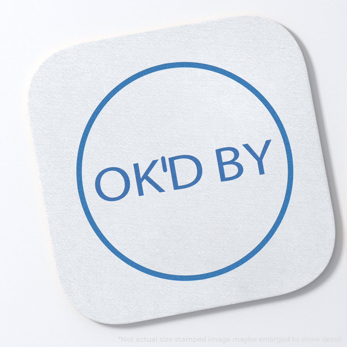 "OK'd by" stamp impression on light paper stock, Xstamper OK'd By Approval Stamp – Round Pre-Inked