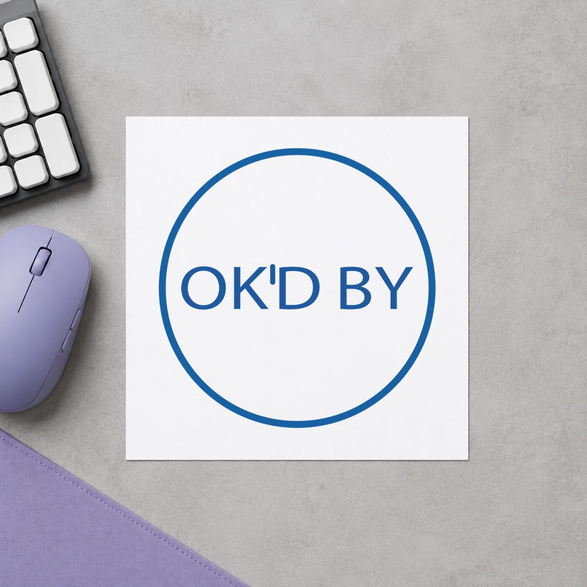 "OK'd by" impression shown close up, round imprint at 5/8 in diameter