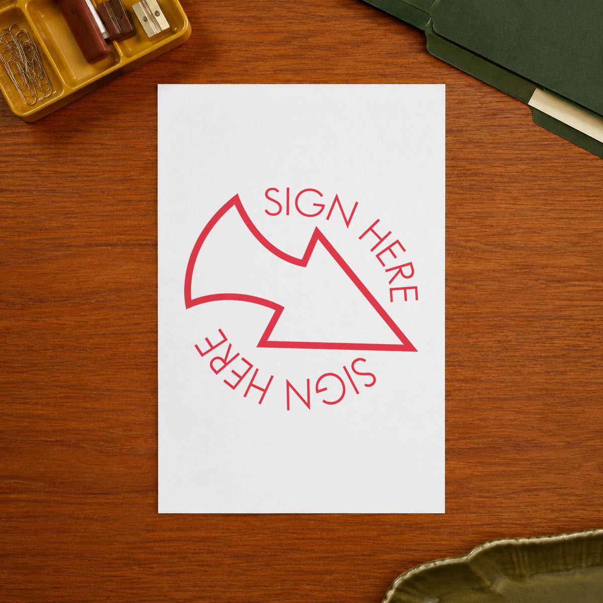 "Sign here" mark added to paperwork with a pre-inked Xstamper stamp