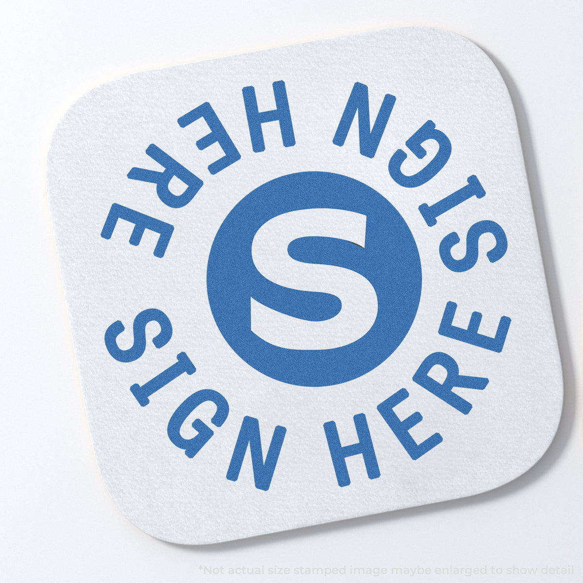 "Sign here" stamp impression on light paper stock, Xstamper Sign Here Stamp – Round Blue Pre-Inked