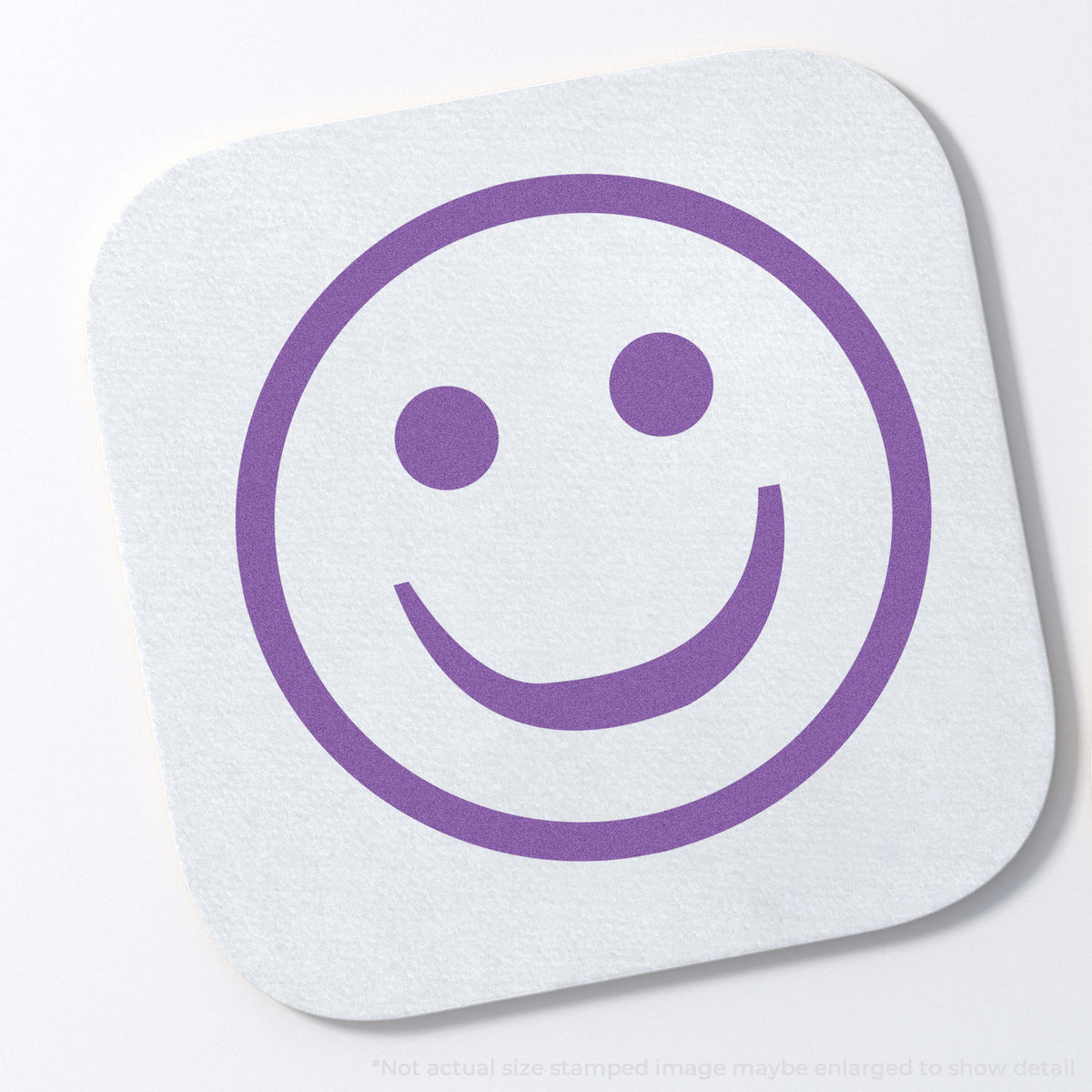 "Smiley face" stamp impression on light paper stock, Xstamper Smiley Face Stamp – Round Violet Pre-Inked
