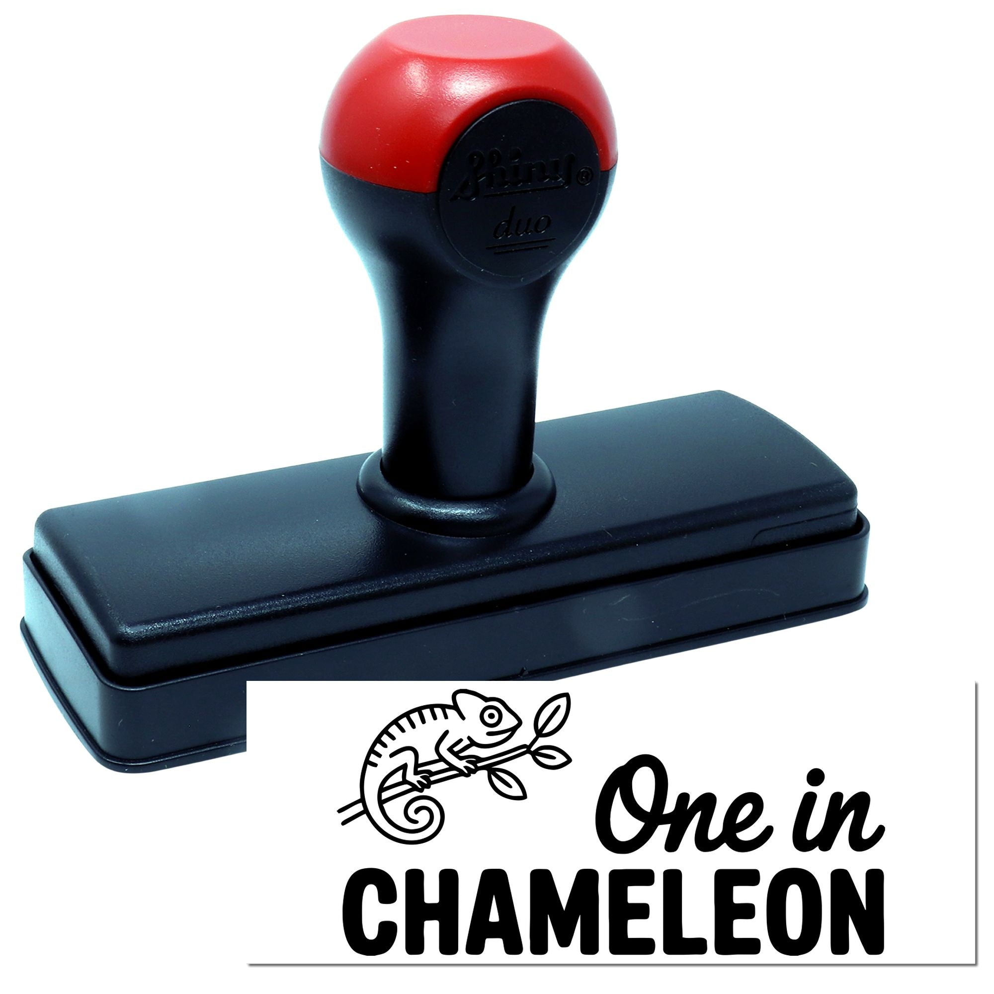 Self-inking rubber stamp featuring a chameleon and "One in CHAMELEON" for custom animal-themed crafting.